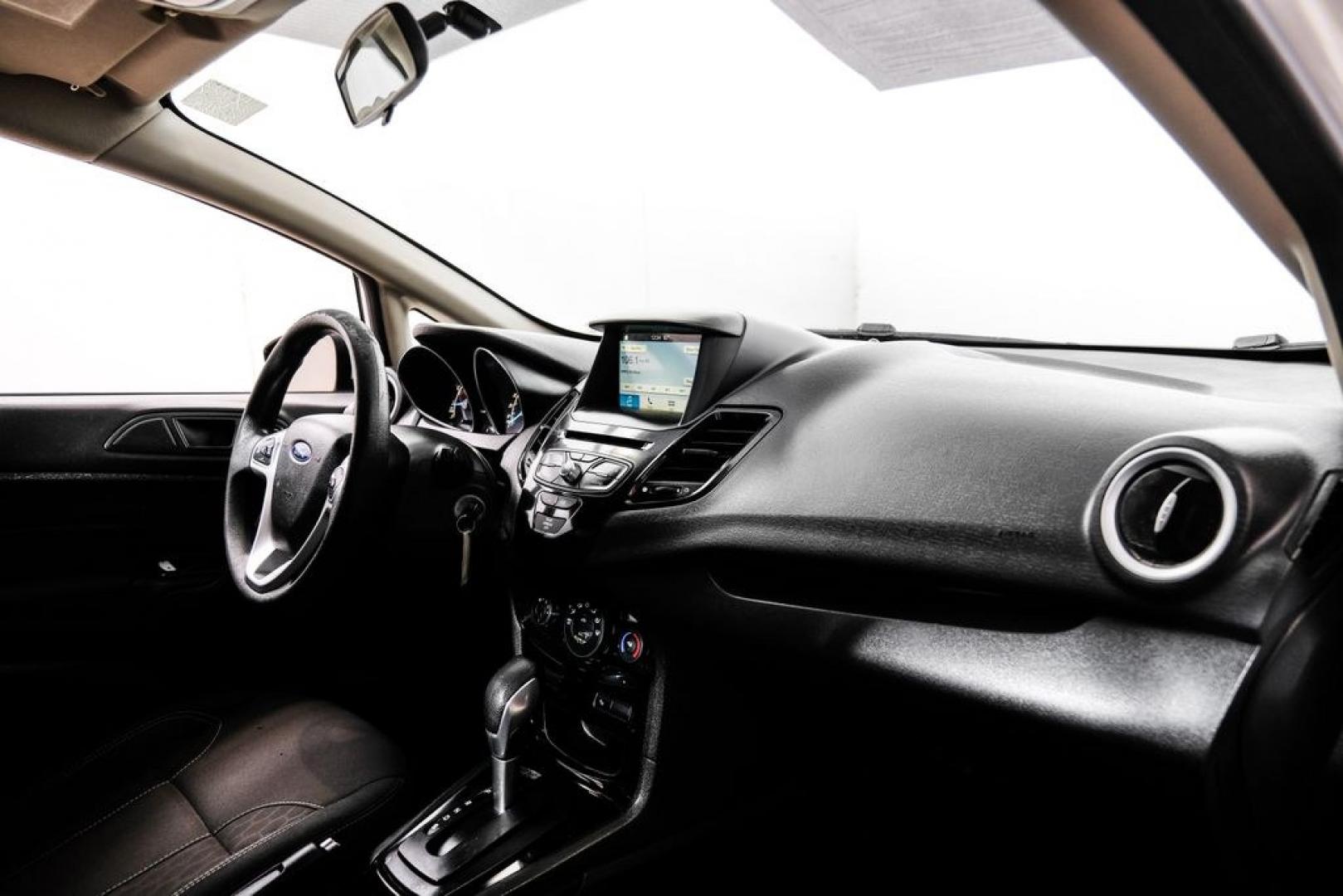 2019 Oxford White /Black Ford Fiesta SE (3FADP4BJ6KM) with an 1.6L I4 Ti-VCT engine, Automatic transmission, located at 15300 Midway Rd., Addison, TX, 75001, (972) 702-0011, 32.958321, -96.838074- Photo#13