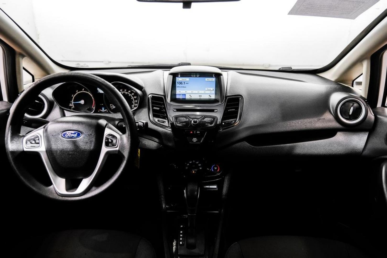 2019 Oxford White /Black Ford Fiesta SE (3FADP4BJ6KM) with an 1.6L I4 Ti-VCT engine, Automatic transmission, located at 15300 Midway Rd., Addison, TX, 75001, (972) 702-0011, 32.958321, -96.838074- Photo#14