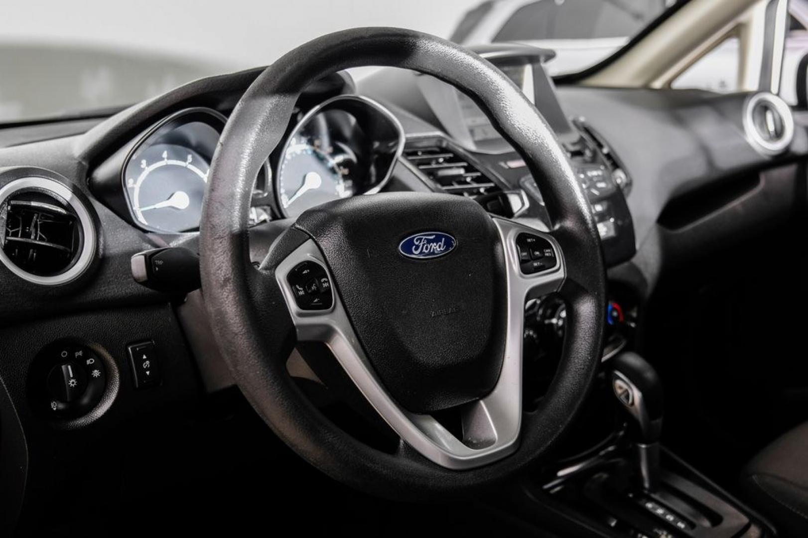 2019 Oxford White /Black Ford Fiesta SE (3FADP4BJ6KM) with an 1.6L I4 Ti-VCT engine, Automatic transmission, located at 15300 Midway Rd., Addison, TX, 75001, (972) 702-0011, 32.958321, -96.838074- Photo#16