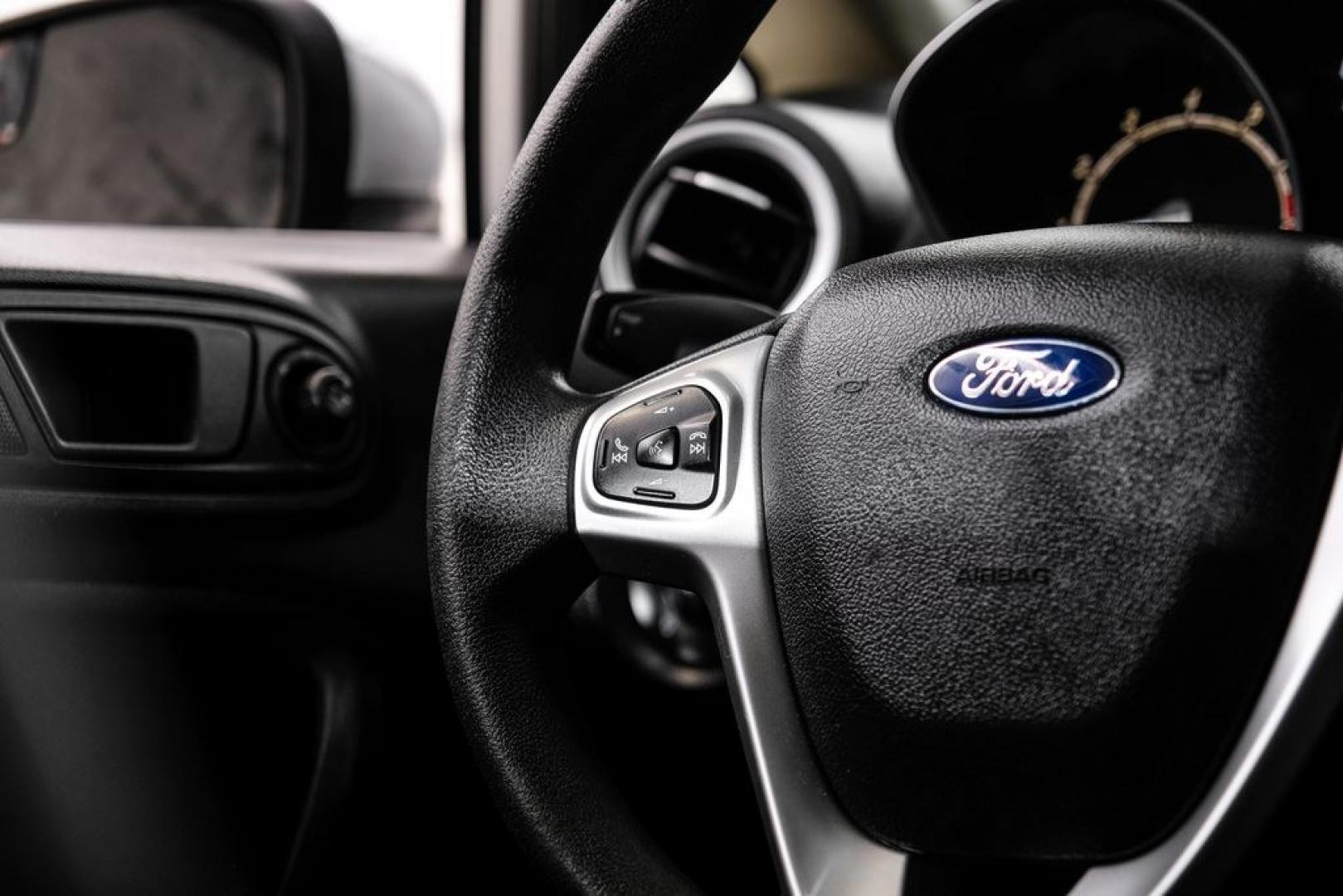 2019 Oxford White /Black Ford Fiesta SE (3FADP4BJ6KM) with an 1.6L I4 Ti-VCT engine, Automatic transmission, located at 15300 Midway Rd., Addison, TX, 75001, (972) 702-0011, 32.958321, -96.838074- Photo#18
