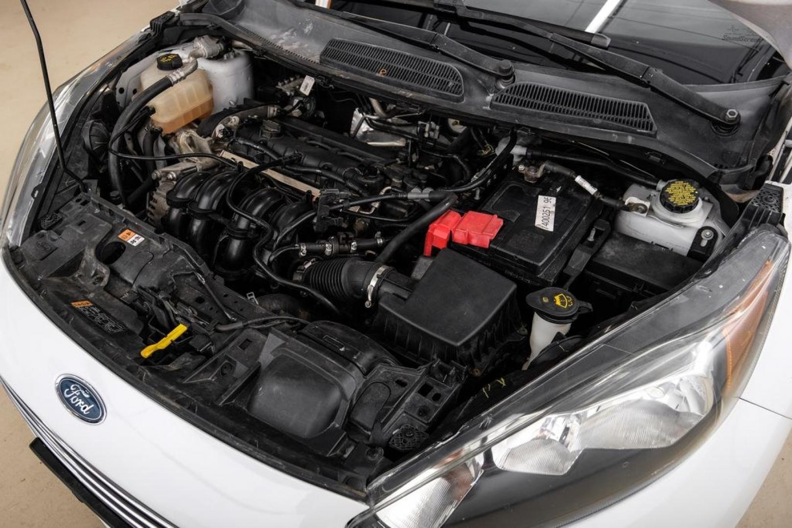2019 Oxford White /Black Ford Fiesta SE (3FADP4BJ6KM) with an 1.6L I4 Ti-VCT engine, Automatic transmission, located at 15300 Midway Rd., Addison, TX, 75001, (972) 702-0011, 32.958321, -96.838074- Photo#52