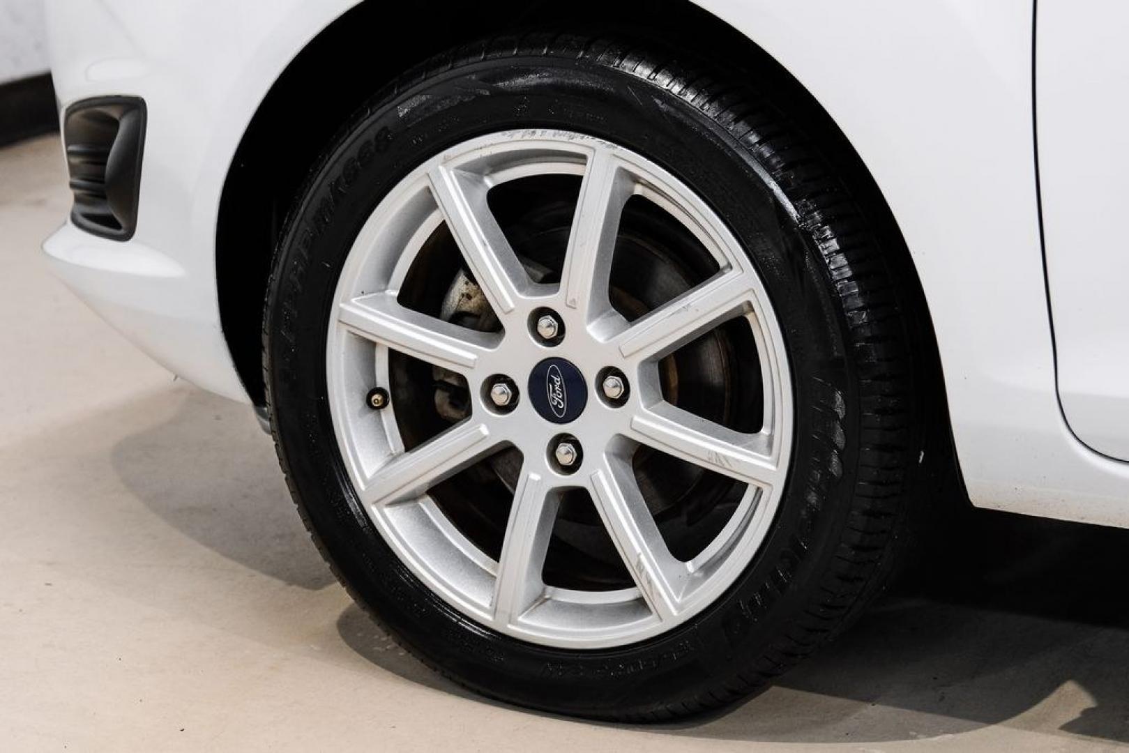 2019 Oxford White /Black Ford Fiesta SE (3FADP4BJ6KM) with an 1.6L I4 Ti-VCT engine, Automatic transmission, located at 15300 Midway Rd., Addison, TX, 75001, (972) 702-0011, 32.958321, -96.838074- Photo#57