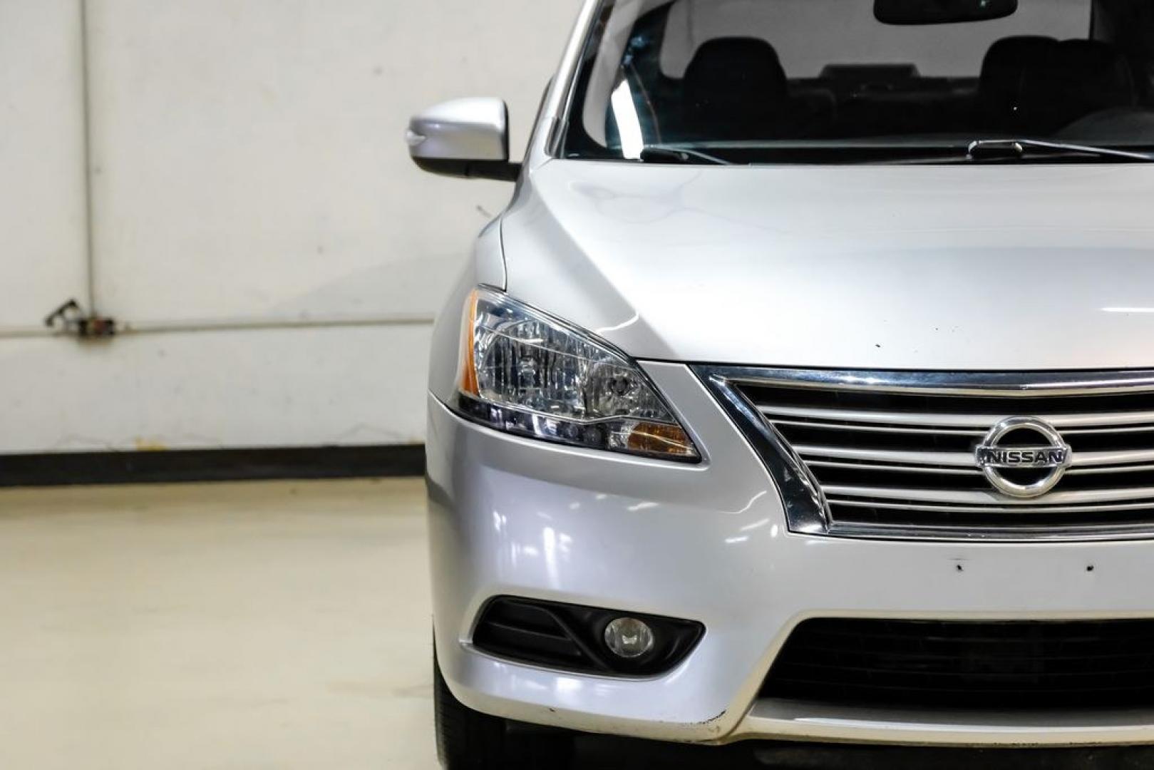 2015 Brilliant Silver /Charcoal Nissan Sentra SL (3N1AB7AP2FY) with an 1.8L 4-Cylinder DOHC 16V engine, CVT transmission, located at 15300 Midway Rd., Addison, TX, 75001, (972) 702-0011, 32.958321, -96.838074- Photo#38