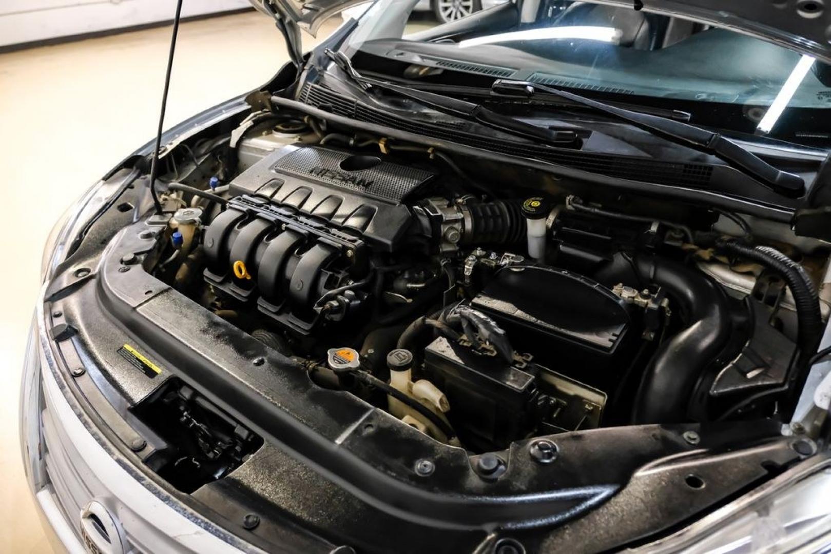 2015 Brilliant Silver /Charcoal Nissan Sentra SL (3N1AB7AP2FY) with an 1.8L 4-Cylinder DOHC 16V engine, CVT transmission, located at 15300 Midway Rd., Addison, TX, 75001, (972) 702-0011, 32.958321, -96.838074- Photo#40