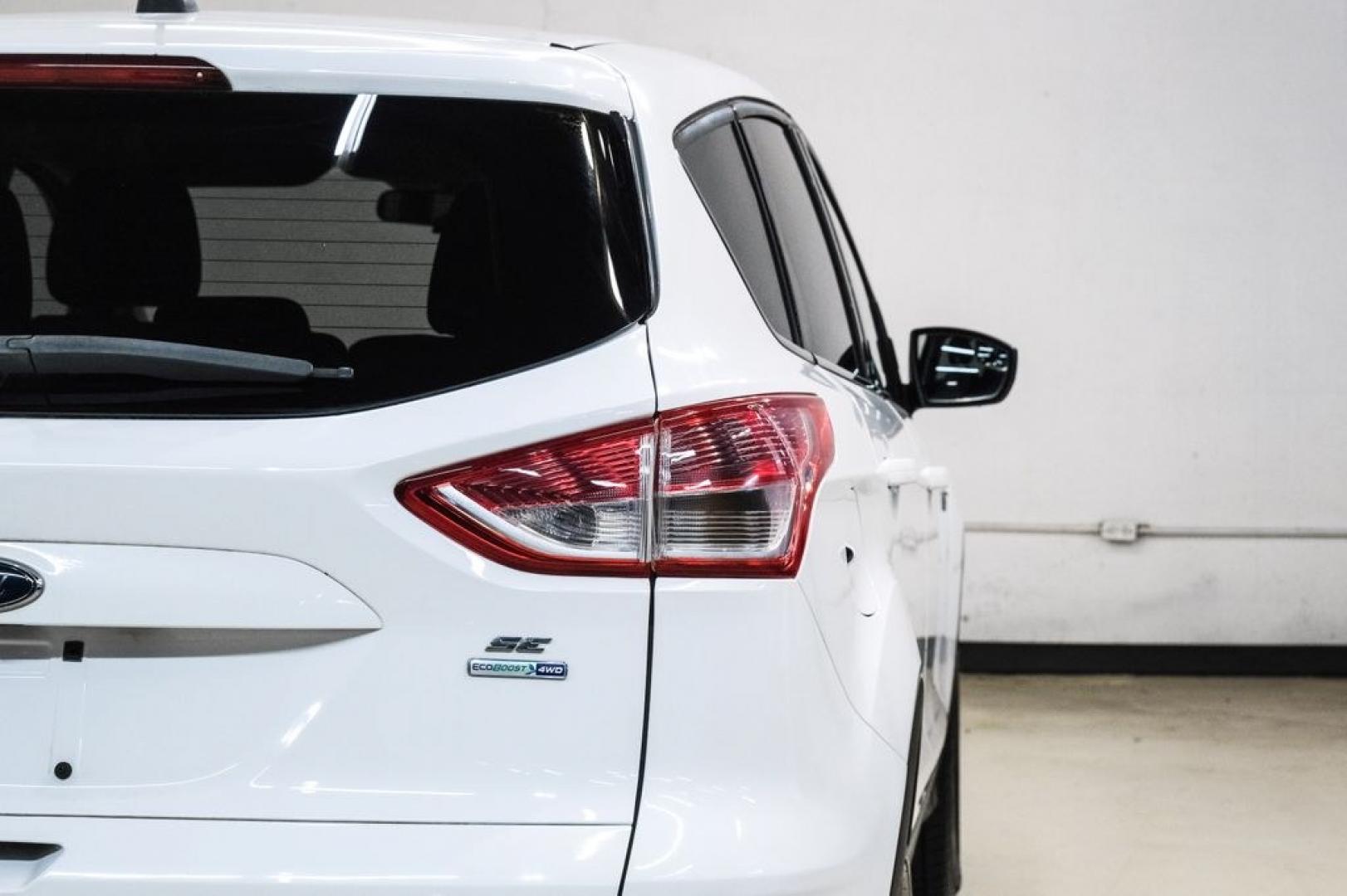 2015 Oxford White /Black Ford Escape SE (1FMCU9G91FU) with an EcoBoost 2.0L I4 GTDi DOHC Turbocharged VCT engine, Automatic transmission, located at 15300 Midway Rd., Addison, TX, 75001, (972) 702-0011, 32.958321, -96.838074- Photo#47