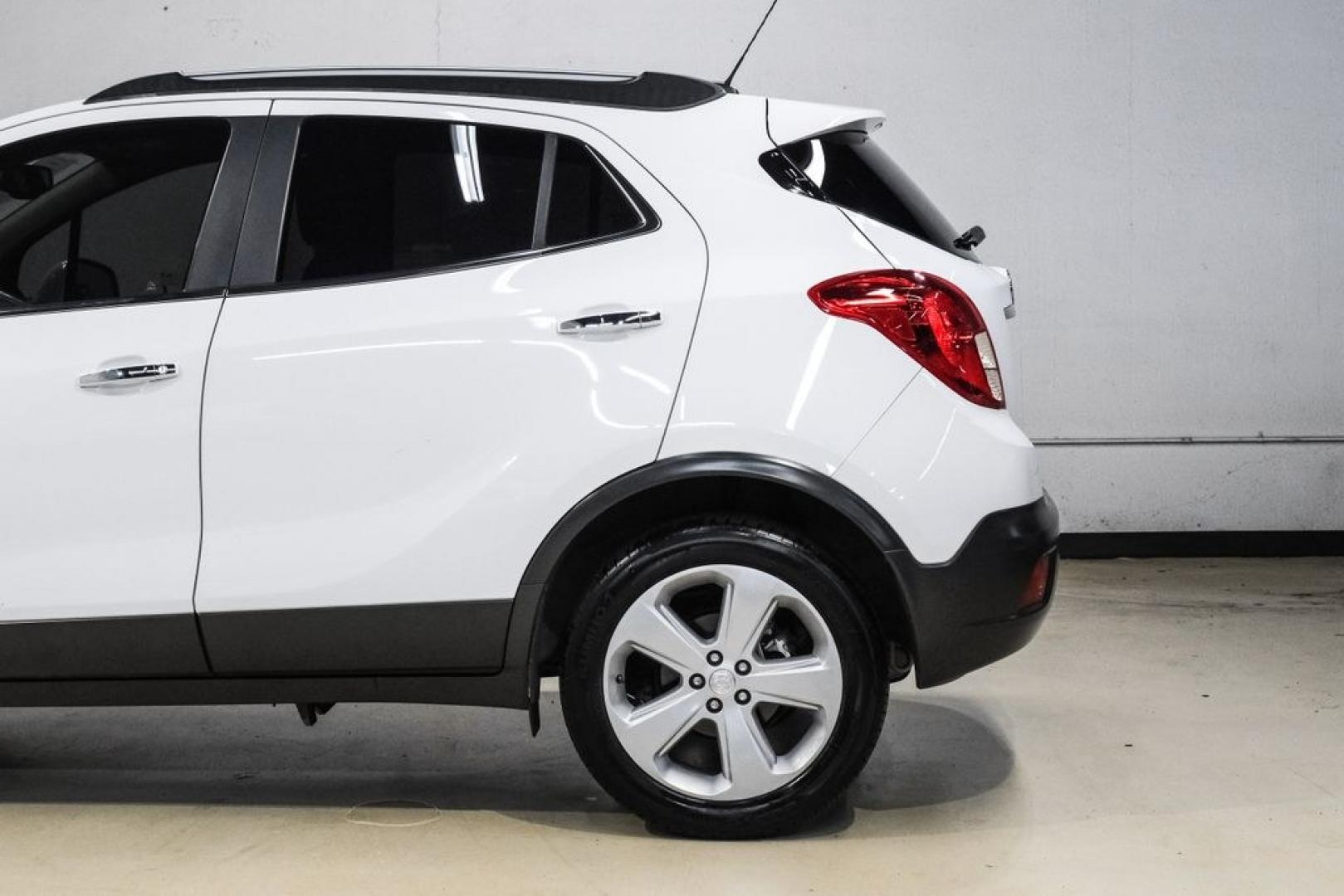 2016 Summit White /Saddle Buick Encore Leather (KL4CJCSBXGB) with an ECOTEC 1.4L I4 SMPI DOHC Turbocharged VVT engine, Automatic transmission, located at 15300 Midway Rd., Addison, TX, 75001, (972) 702-0011, 32.958321, -96.838074- Photo#16