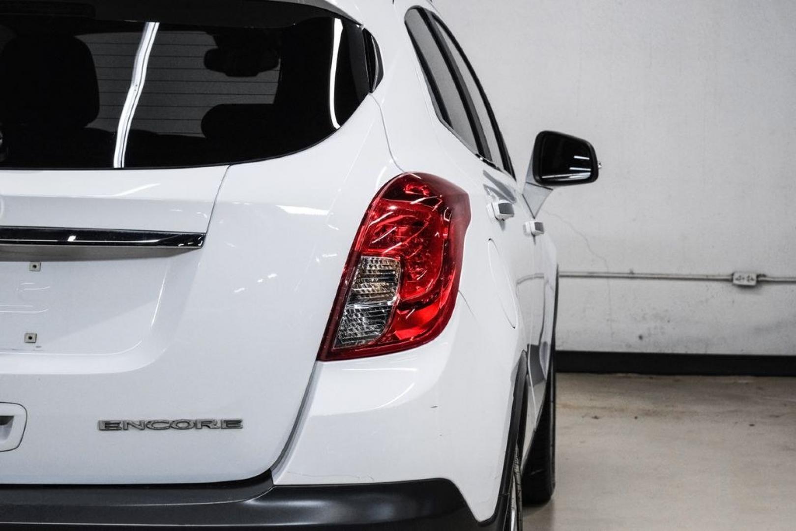2016 Summit White /Saddle Buick Encore Leather (KL4CJCSBXGB) with an ECOTEC 1.4L I4 SMPI DOHC Turbocharged VVT engine, Automatic transmission, located at 15300 Midway Rd., Addison, TX, 75001, (972) 702-0011, 32.958321, -96.838074- Photo#48
