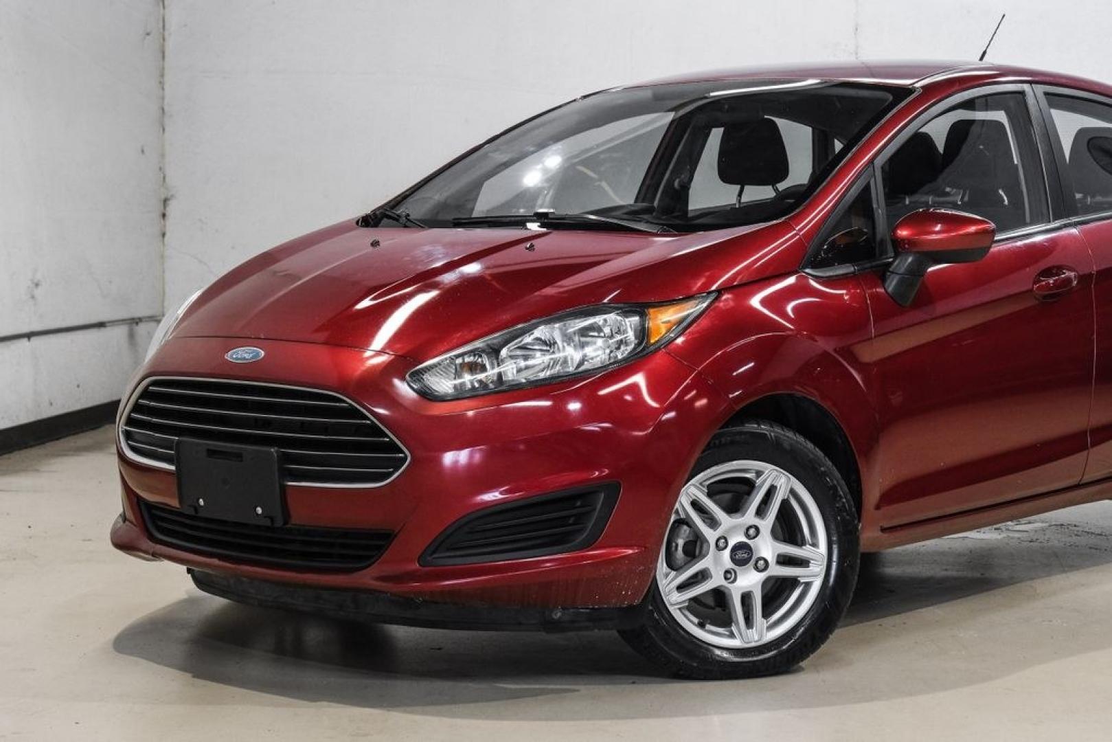 2017 Ruby Red Metallic /Black Ford Fiesta SE (3FADP4BJ4HM) with an 1.6L I4 Ti-VCT engine, Automatic transmission, located at 15300 Midway Rd., Addison, TX, 75001, (972) 702-0011, 32.958321, -96.838074- Photo#4