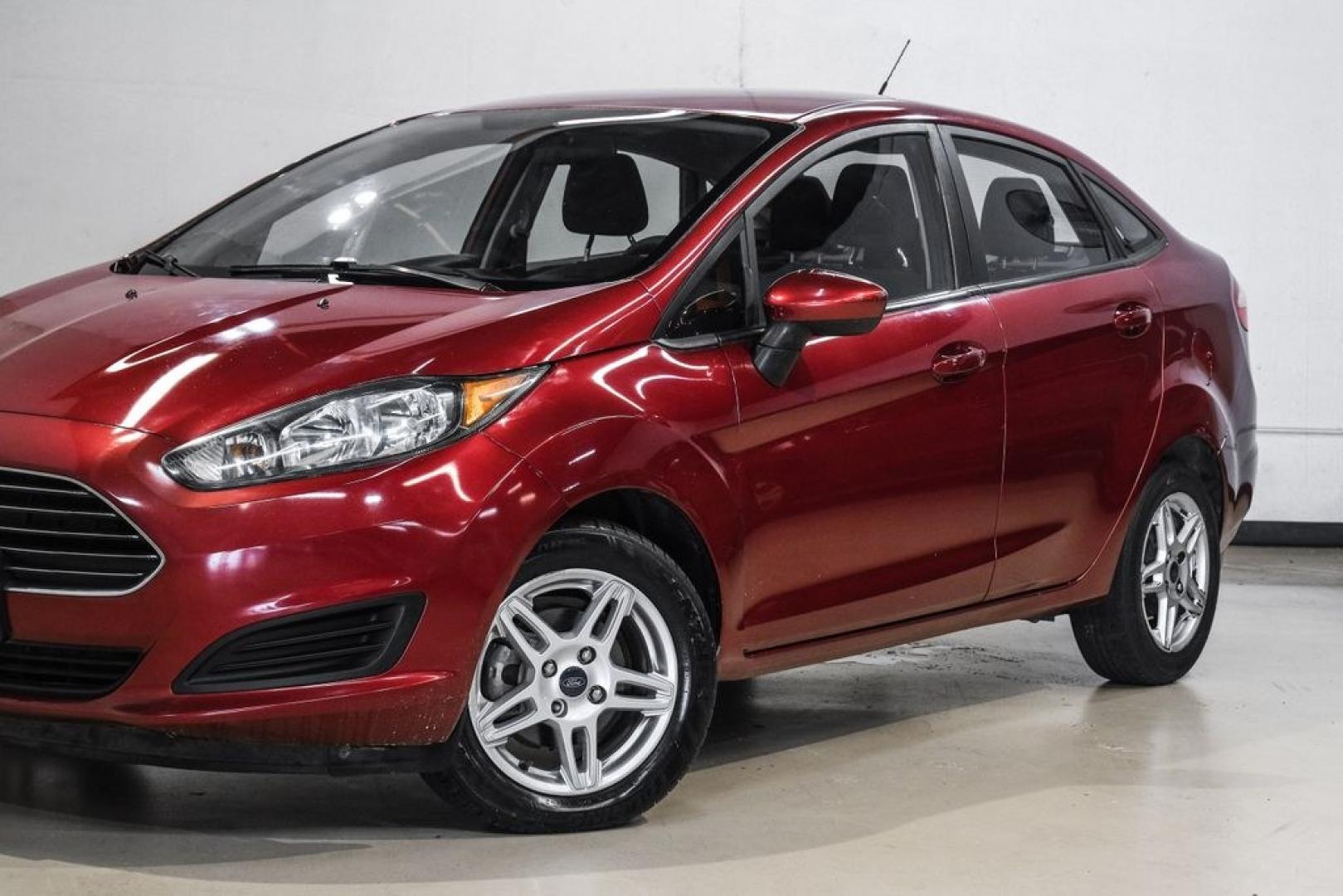 2017 Ruby Red Metallic /Black Ford Fiesta SE (3FADP4BJ4HM) with an 1.6L I4 Ti-VCT engine, Automatic transmission, located at 15300 Midway Rd., Addison, TX, 75001, (972) 702-0011, 32.958321, -96.838074- Photo#5