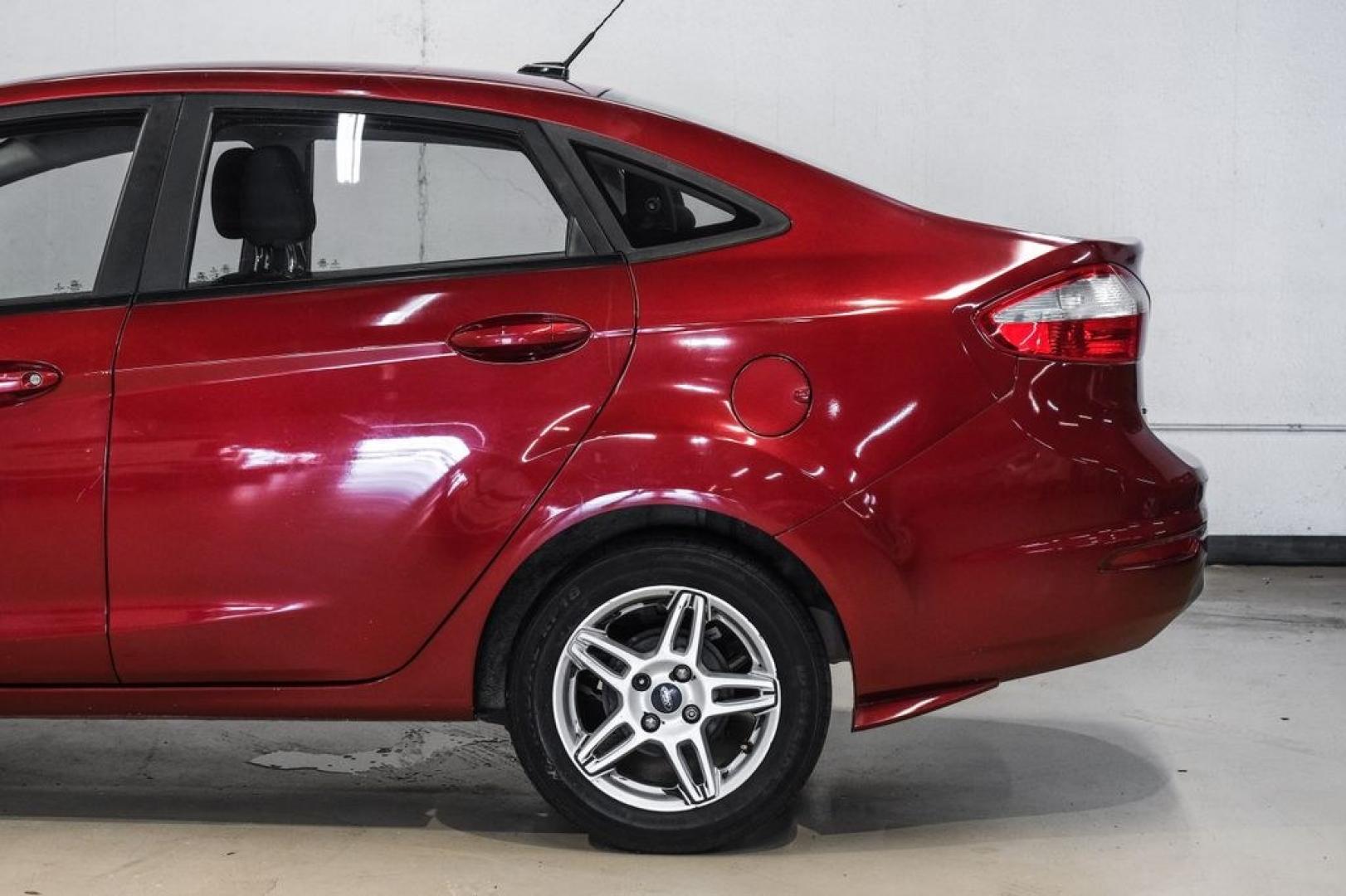 2017 Ruby Red Metallic /Black Ford Fiesta SE (3FADP4BJ4HM) with an 1.6L I4 Ti-VCT engine, Automatic transmission, located at 15300 Midway Rd., Addison, TX, 75001, (972) 702-0011, 32.958321, -96.838074- Photo#16