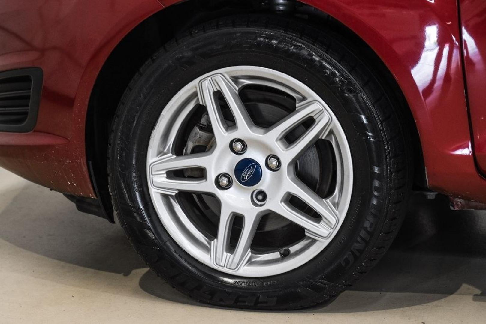 2017 Ruby Red Metallic /Black Ford Fiesta SE (3FADP4BJ4HM) with an 1.6L I4 Ti-VCT engine, Automatic transmission, located at 15300 Midway Rd., Addison, TX, 75001, (972) 702-0011, 32.958321, -96.838074- Photo#52