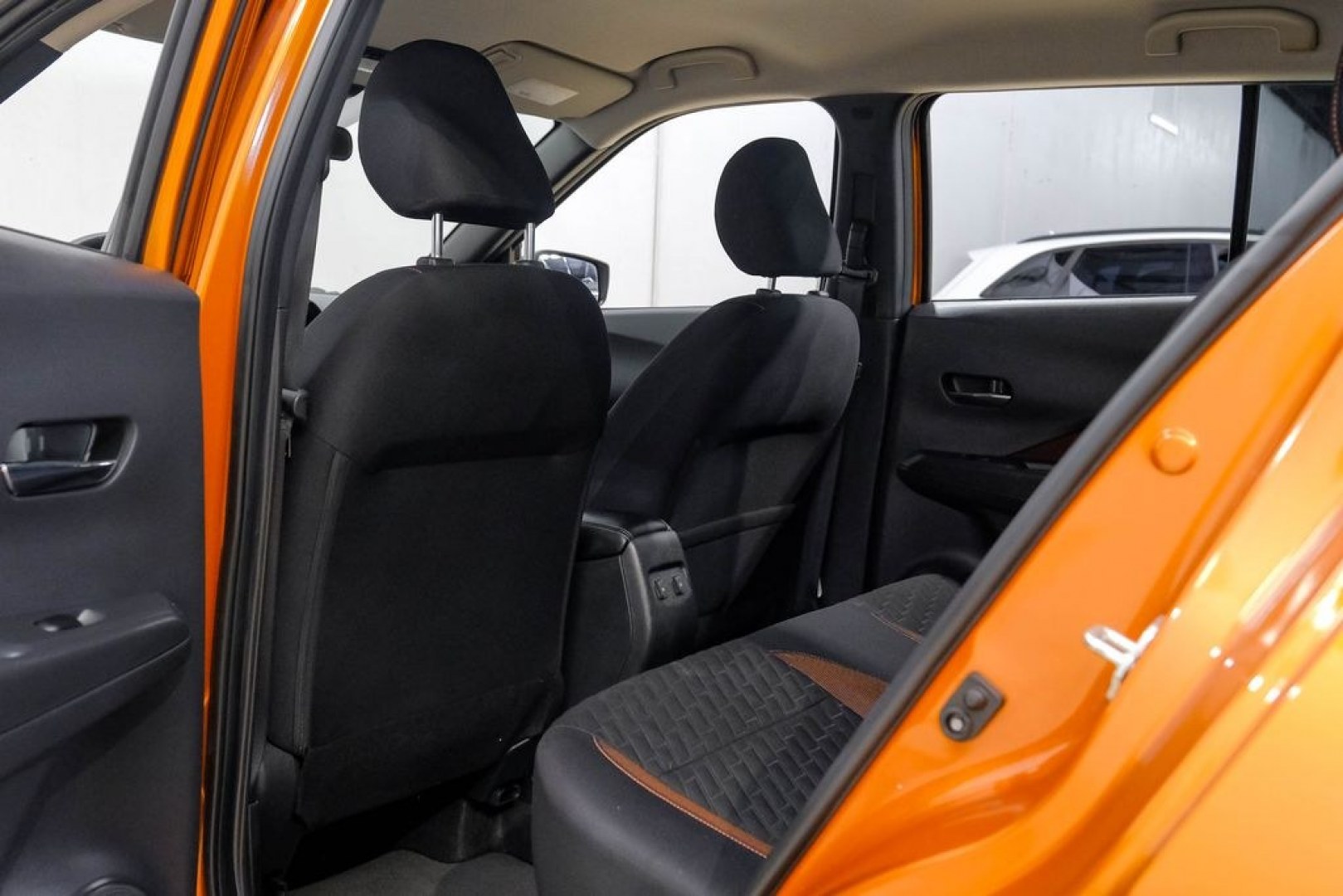 2023 Orange Metallic /Charcoal Nissan Kicks SR (3N1CP5DVXPL) with an 1.6L 4-Cylinder DOHC 16V engine, CVT transmission, located at 15300 Midway Rd., Addison, TX, 75001, (972) 702-0011, 32.958321, -96.838074- Photo#48