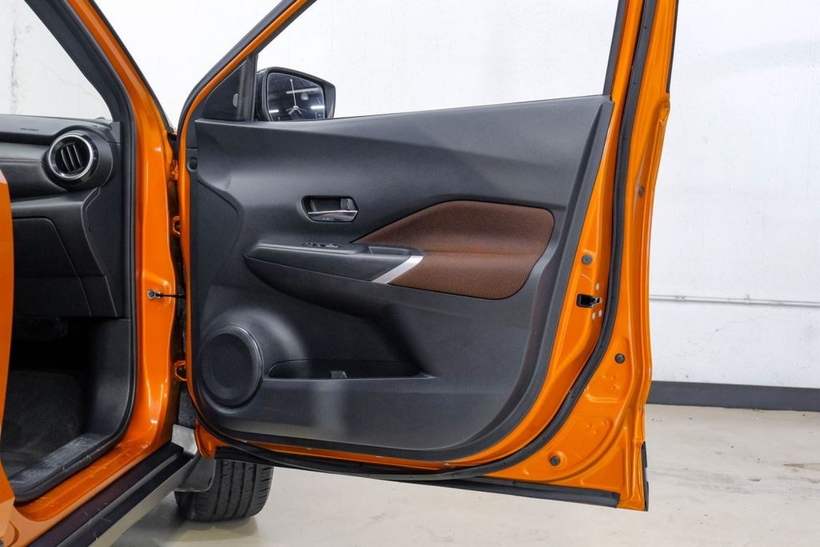 2023 Orange Metallic /Charcoal Nissan Kicks SR (3N1CP5DVXPL) with an 1.6L 4-Cylinder DOHC 16V engine, CVT transmission, located at 15300 Midway Rd., Addison, TX, 75001, (972) 702-0011, 32.958321, -96.838074- Photo#54