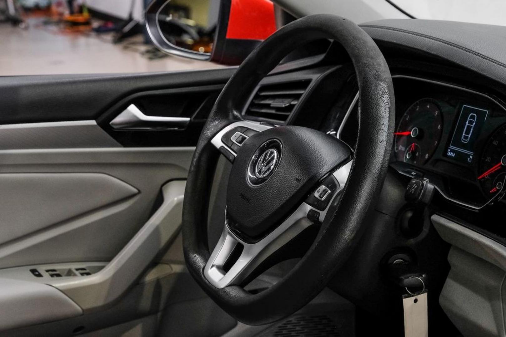 2019 Habanero Orange Metallic /Dark Beige Volkswagen Jetta 1.4T S (3VWN57BU9KM) with an 1.4L TSI engine, Manual transmission, located at 15300 Midway Rd., Addison, TX, 75001, (972) 702-0011, 32.958321, -96.838074- Photo#19