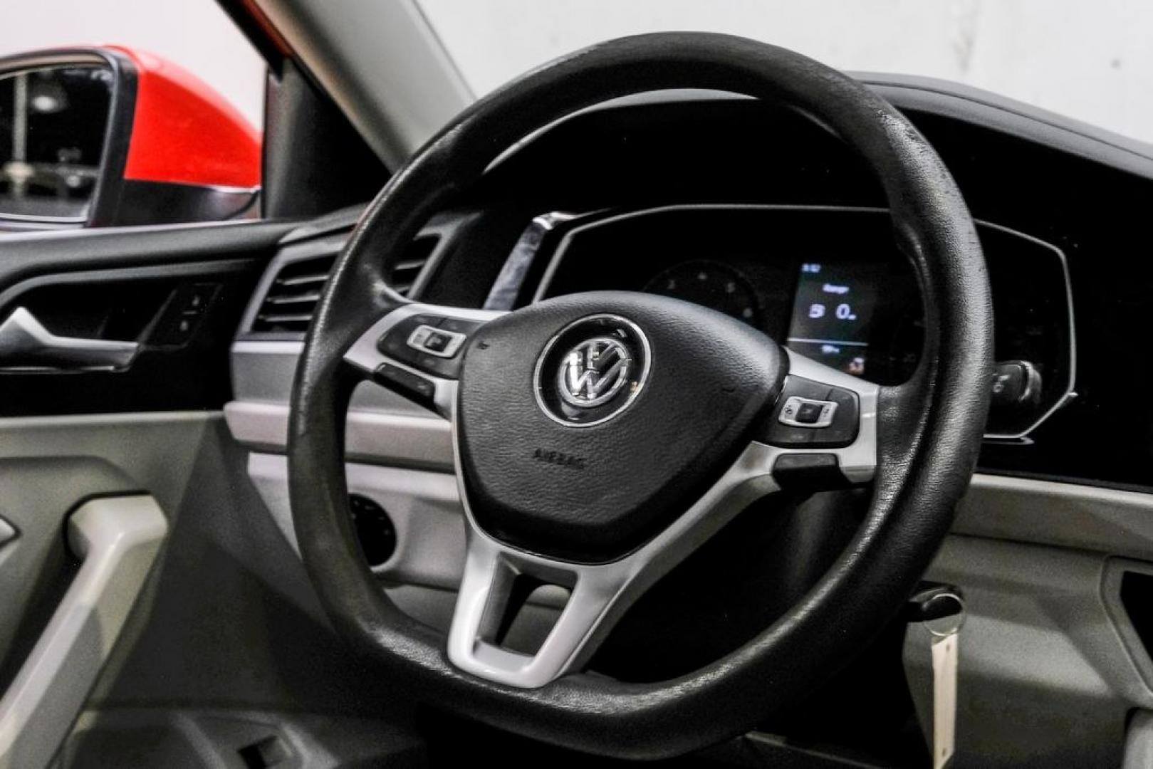 2019 Habanero Orange Metallic /Dark Beige Volkswagen Jetta 1.4T S (3VWN57BU9KM) with an 1.4L TSI engine, Manual transmission, located at 15300 Midway Rd., Addison, TX, 75001, (972) 702-0011, 32.958321, -96.838074- Photo#20