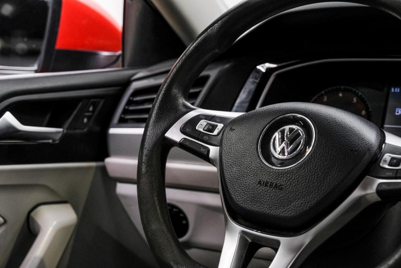 2019 Habanero Orange Metallic /Dark Beige Volkswagen Jetta 1.4T S (3VWN57BU9KM) with an 1.4L TSI engine, Manual transmission, located at 15300 Midway Rd., Addison, TX, 75001, (972) 702-0011, 32.958321, -96.838074- Photo#22