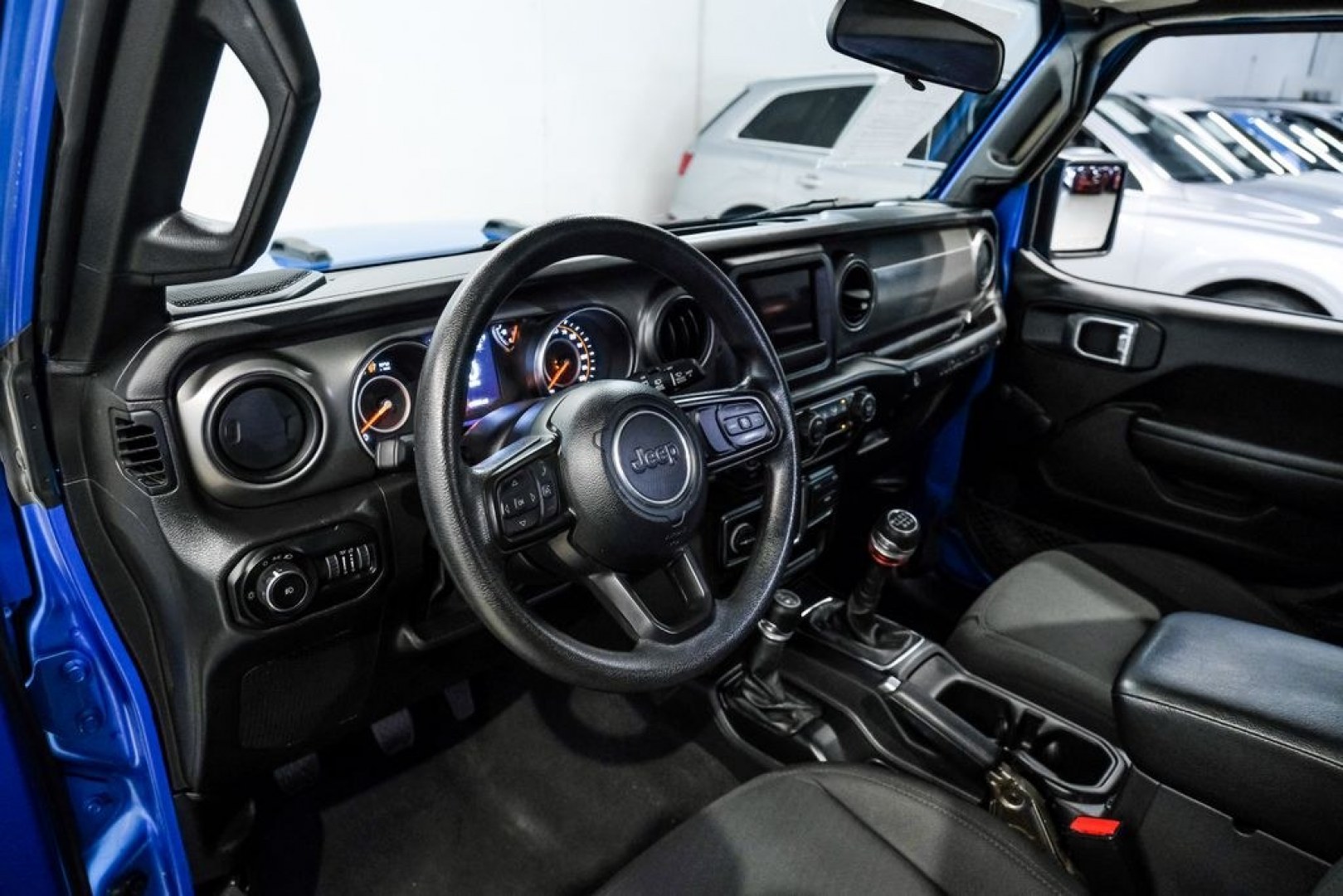 2022 Blue Pearl /Black Jeep Wrangler Sport (1C4GJXAG0NW) with an 3.6L V6 24V VVT engine, Manual transmission, located at 15300 Midway Rd., Addison, TX, 75001, (972) 702-0011, 32.958321, -96.838074- Photo#2