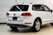 2014 Pure White /Saddle Brown Volkswagen Touareg 3.6L (WVGEF9BPXED) with an 3.6L V6 DOHC engine, Automatic transmission, located at 15300 Midway Rd., Addison, TX, 75001, (972) 702-0011, 32.958321, -96.838074- Photo#11