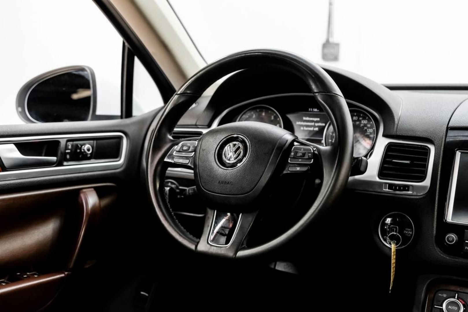 2014 Pure White /Saddle Brown Volkswagen Touareg 3.6L (WVGEF9BPXED) with an 3.6L V6 DOHC engine, Automatic transmission, located at 15300 Midway Rd., Addison, TX, 75001, (972) 702-0011, 32.958321, -96.838074- Photo#20