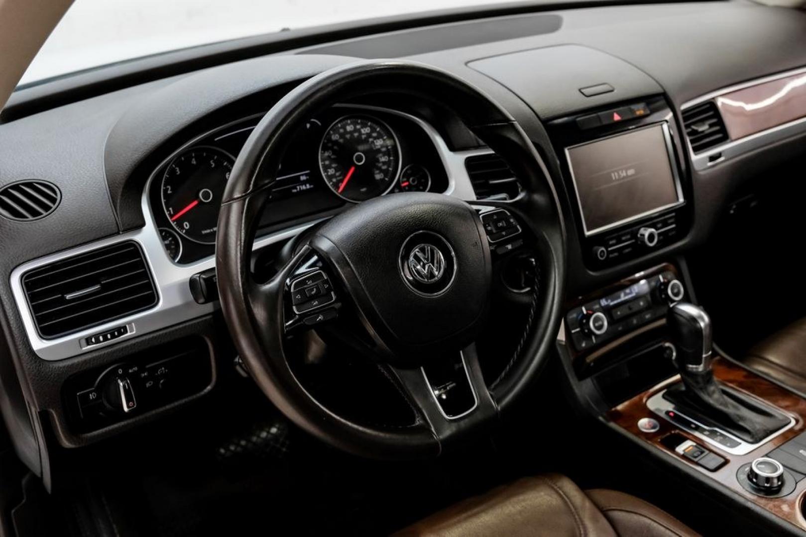 2014 Pure White /Saddle Brown Volkswagen Touareg 3.6L (WVGEF9BPXED) with an 3.6L V6 DOHC engine, Automatic transmission, located at 15300 Midway Rd., Addison, TX, 75001, (972) 702-0011, 32.958321, -96.838074- Photo#21