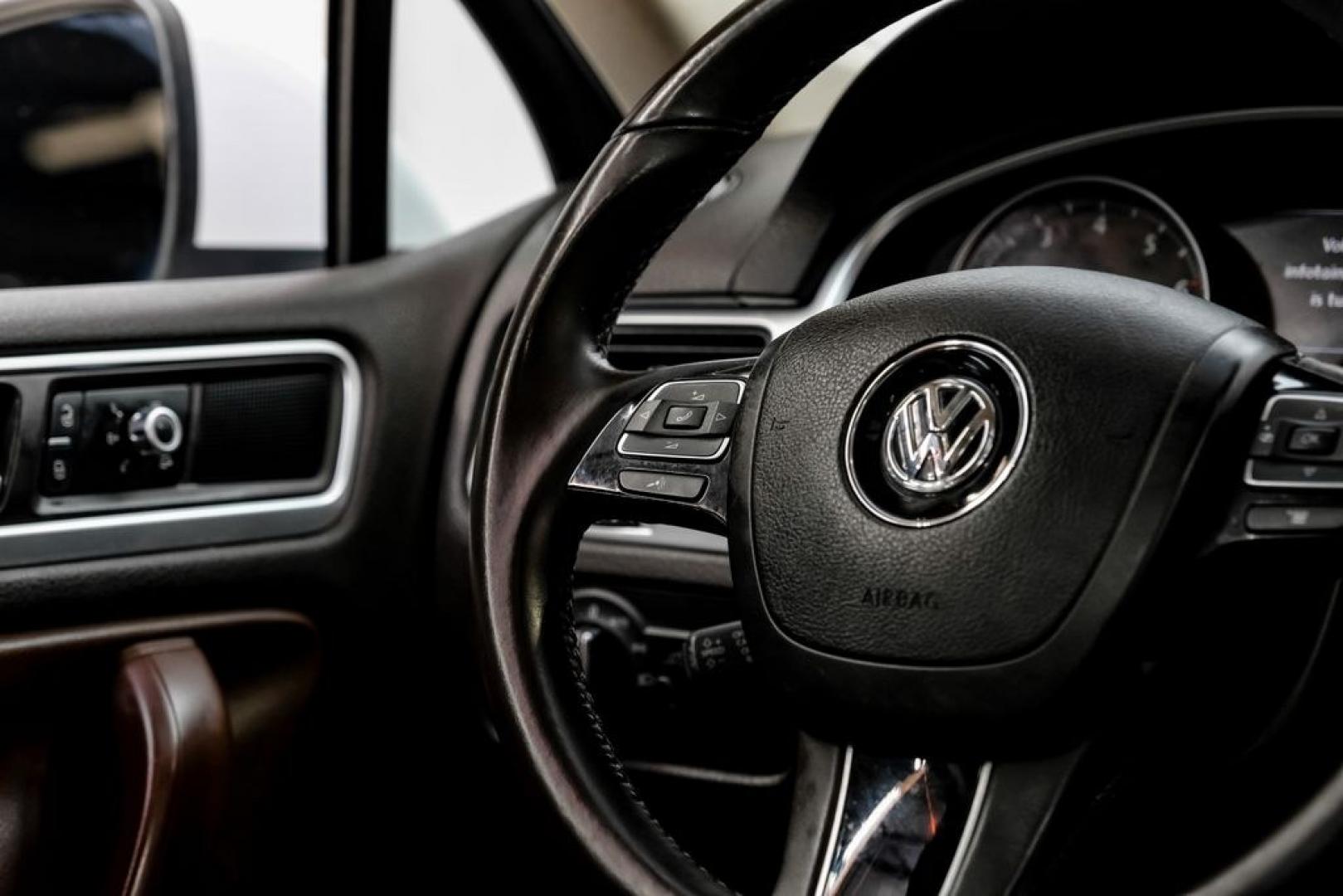 2014 Pure White /Saddle Brown Volkswagen Touareg 3.6L (WVGEF9BPXED) with an 3.6L V6 DOHC engine, Automatic transmission, located at 15300 Midway Rd., Addison, TX, 75001, (972) 702-0011, 32.958321, -96.838074- Photo#22