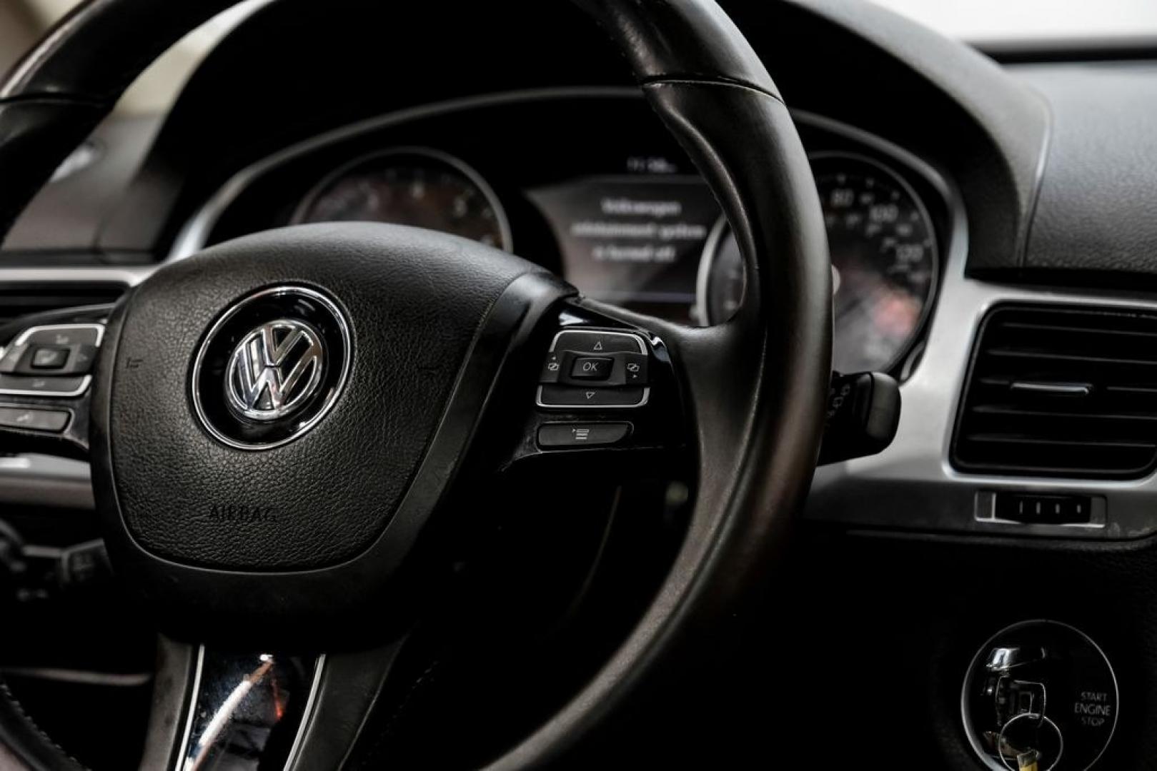 2014 Pure White /Saddle Brown Volkswagen Touareg 3.6L (WVGEF9BPXED) with an 3.6L V6 DOHC engine, Automatic transmission, located at 15300 Midway Rd., Addison, TX, 75001, (972) 702-0011, 32.958321, -96.838074- Photo#23