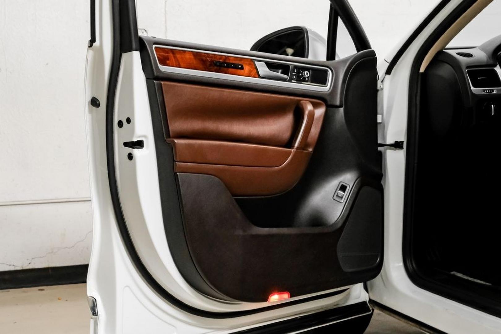 2014 Pure White /Saddle Brown Volkswagen Touareg 3.6L (WVGEF9BPXED) with an 3.6L V6 DOHC engine, Automatic transmission, located at 15300 Midway Rd., Addison, TX, 75001, (972) 702-0011, 32.958321, -96.838074- Photo#48
