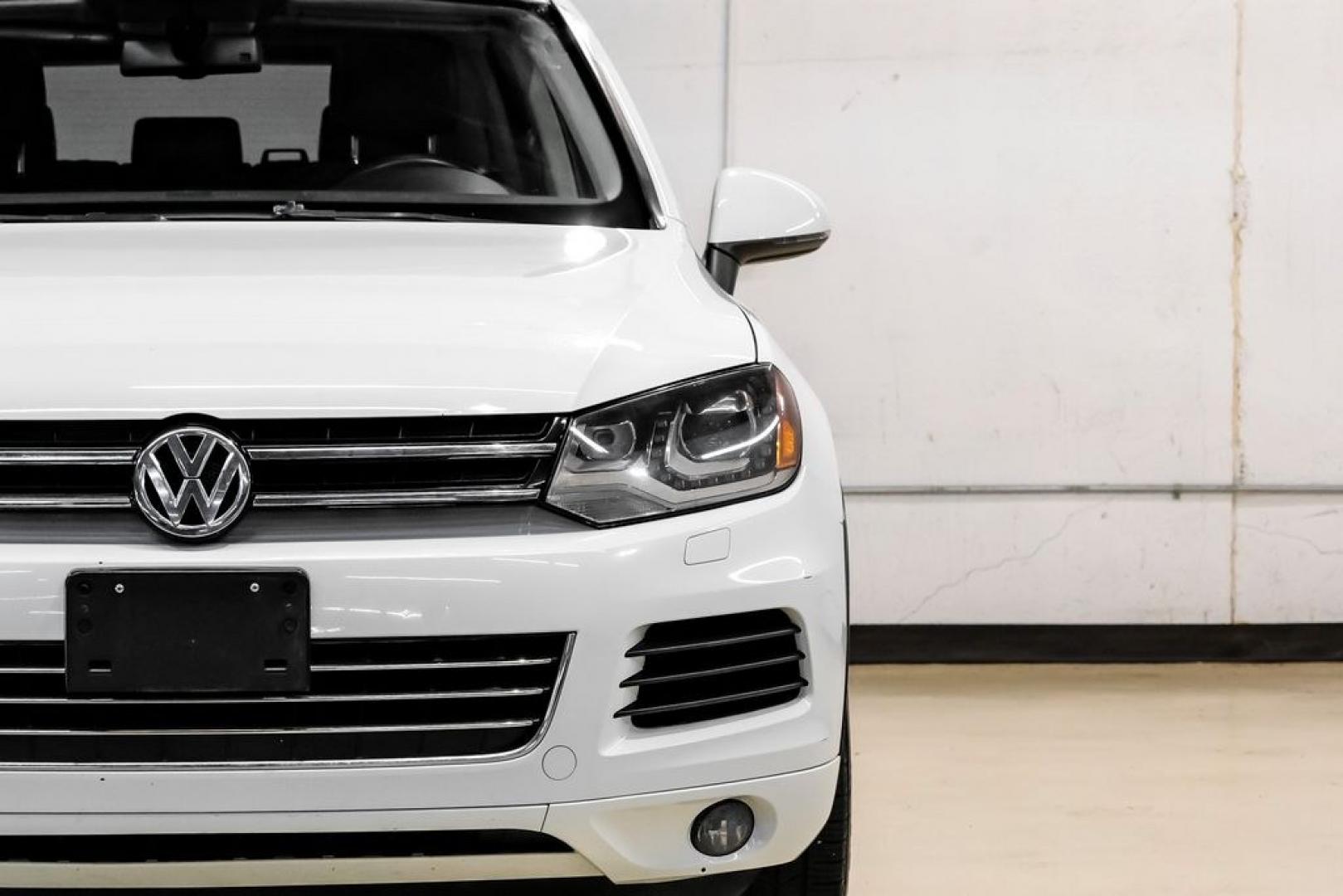 2014 Pure White /Saddle Brown Volkswagen Touareg 3.6L (WVGEF9BPXED) with an 3.6L V6 DOHC engine, Automatic transmission, located at 15300 Midway Rd., Addison, TX, 75001, (972) 702-0011, 32.958321, -96.838074- Photo#54