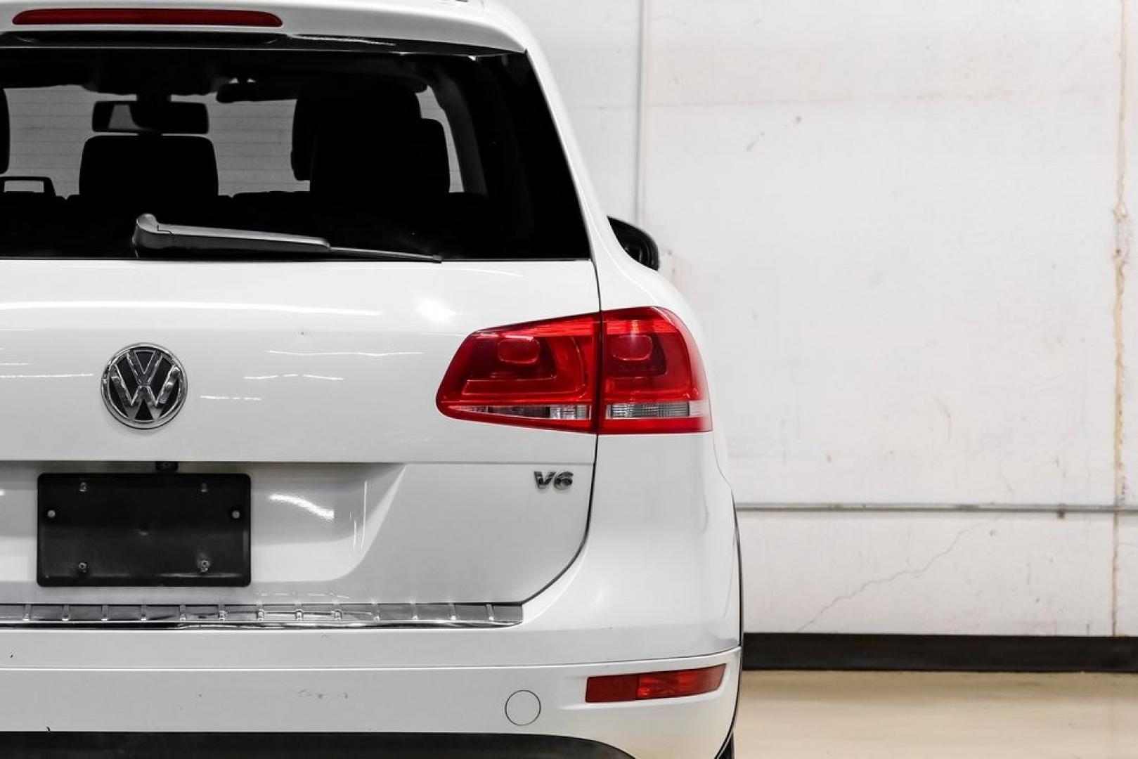 2014 Pure White /Saddle Brown Volkswagen Touareg 3.6L (WVGEF9BPXED) with an 3.6L V6 DOHC engine, Automatic transmission, located at 15300 Midway Rd., Addison, TX, 75001, (972) 702-0011, 32.958321, -96.838074- Photo#55