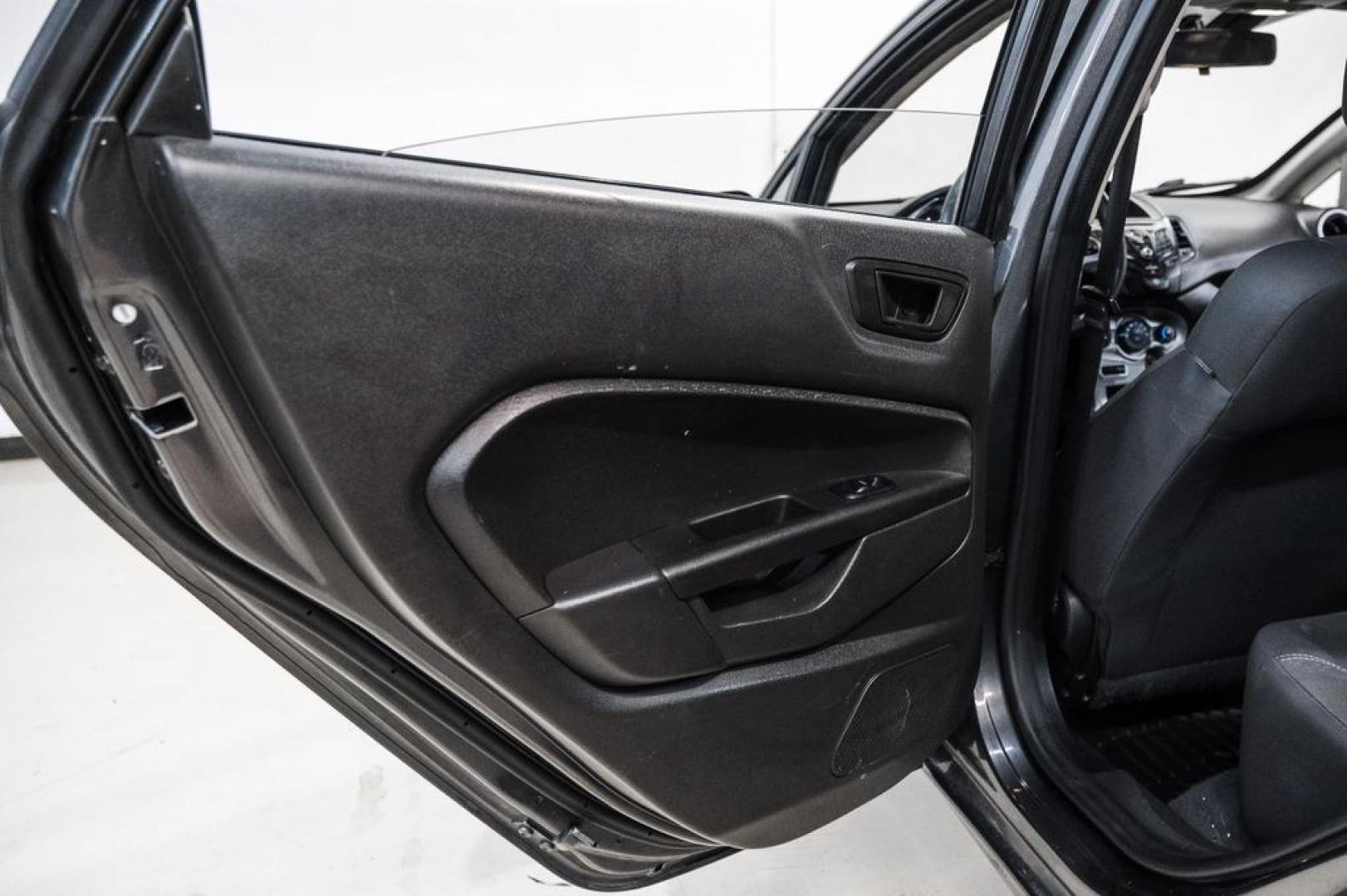 2019 Magnetic /Black Ford Fiesta SE (3FADP4BJXKM) with an 1.6L I4 Ti-VCT engine, Automatic transmission, located at 15300 Midway Rd., Addison, TX, 75001, (972) 702-0011, 32.958321, -96.838074- Photo#35