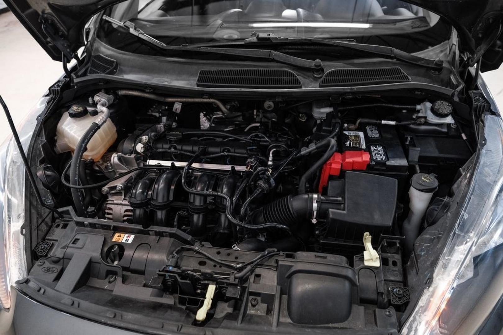 2019 Magnetic /Black Ford Fiesta SE (3FADP4BJXKM) with an 1.6L I4 Ti-VCT engine, Automatic transmission, located at 15300 Midway Rd., Addison, TX, 75001, (972) 702-0011, 32.958321, -96.838074- Photo#38