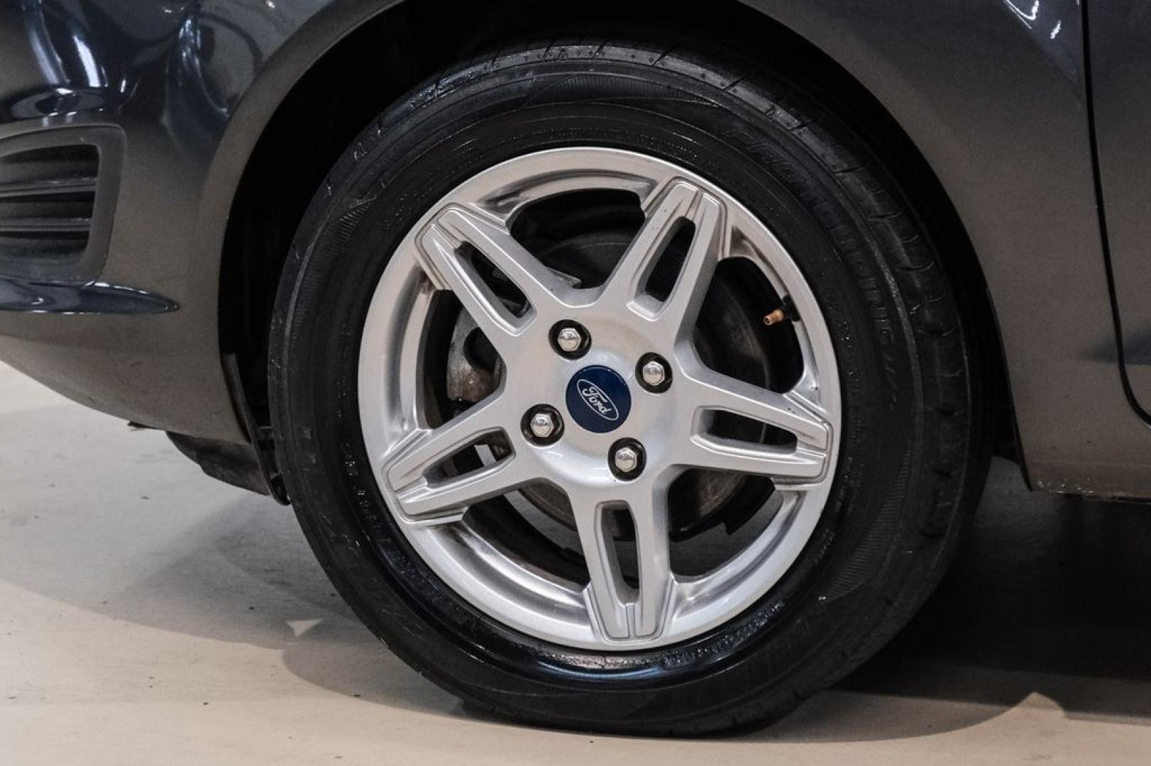 2019 Magnetic /Black Ford Fiesta SE (3FADP4BJXKM) with an 1.6L I4 Ti-VCT engine, Automatic transmission, located at 15300 Midway Rd., Addison, TX, 75001, (972) 702-0011, 32.958321, -96.838074- Photo#43