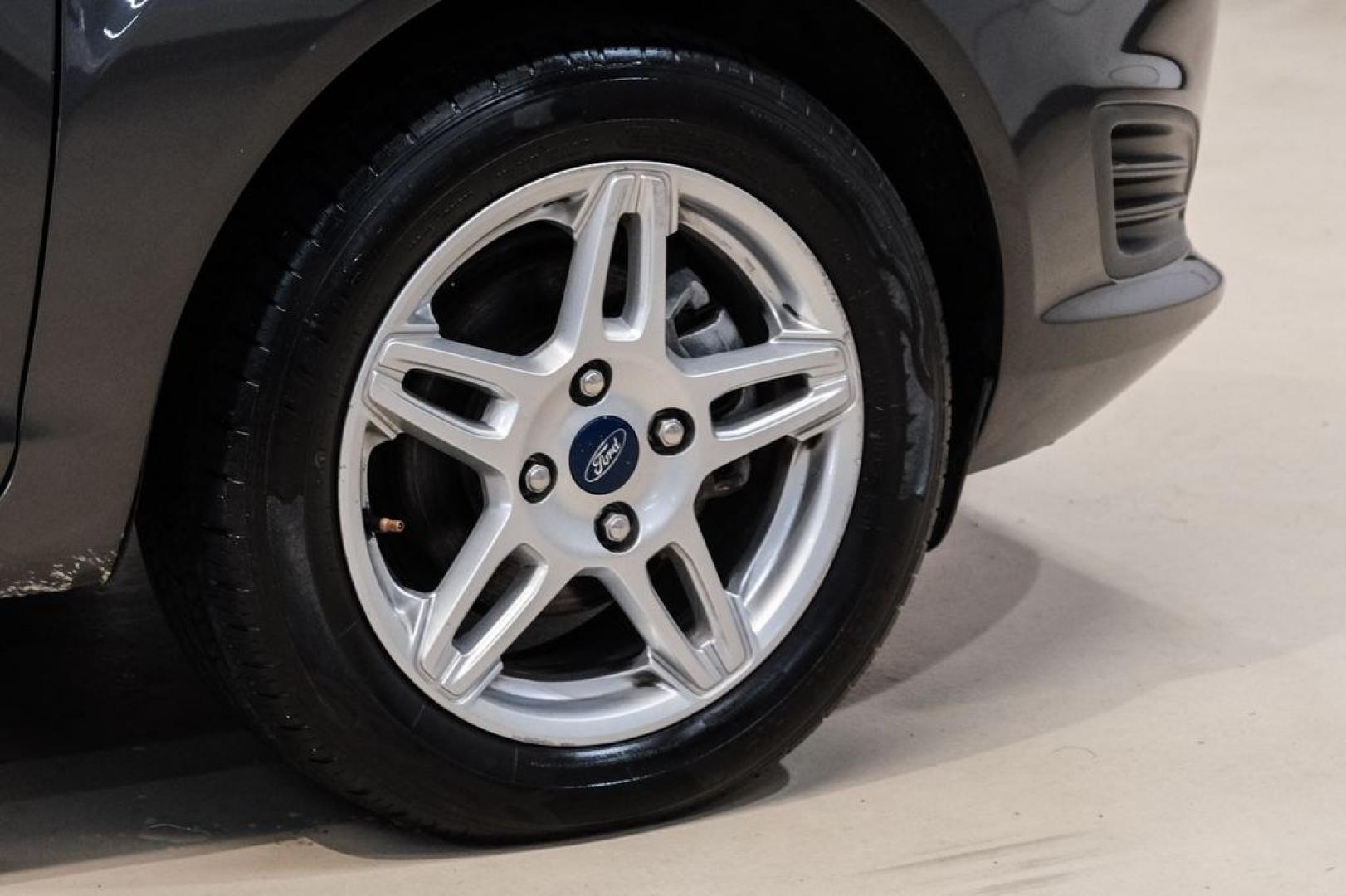 2019 Magnetic /Black Ford Fiesta SE (3FADP4BJXKM) with an 1.6L I4 Ti-VCT engine, Automatic transmission, located at 15300 Midway Rd., Addison, TX, 75001, (972) 702-0011, 32.958321, -96.838074- Photo#46