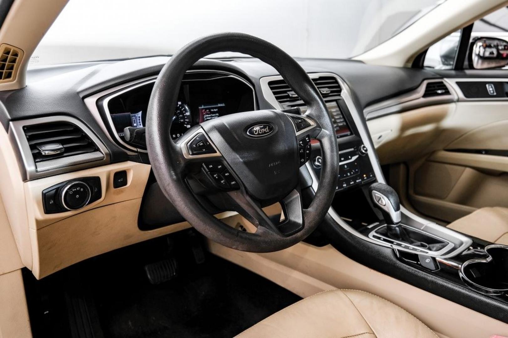 2014 Sterling Gray Metallic /Dune Ford Fusion Hybrid SE (3FA6P0LU0ER) with an 2.0L I4 Atkinson-Cycle Hybrid engine, CVT transmission, located at 15300 Midway Rd., Addison, TX, 75001, (972) 702-0011, 32.958321, -96.838074- Photo#2