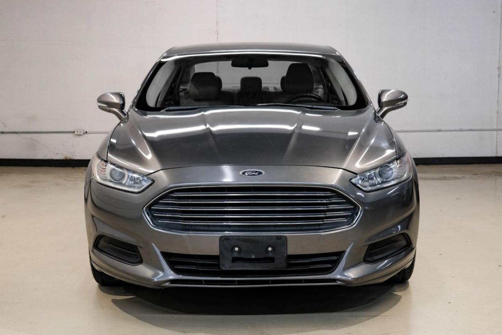 2014 Sterling Gray Metallic /Dune Ford Fusion Hybrid SE (3FA6P0LU0ER) with an 2.0L I4 Atkinson-Cycle Hybrid engine, CVT transmission, located at 15300 Midway Rd., Addison, TX, 75001, (972) 702-0011, 32.958321, -96.838074- Photo#4