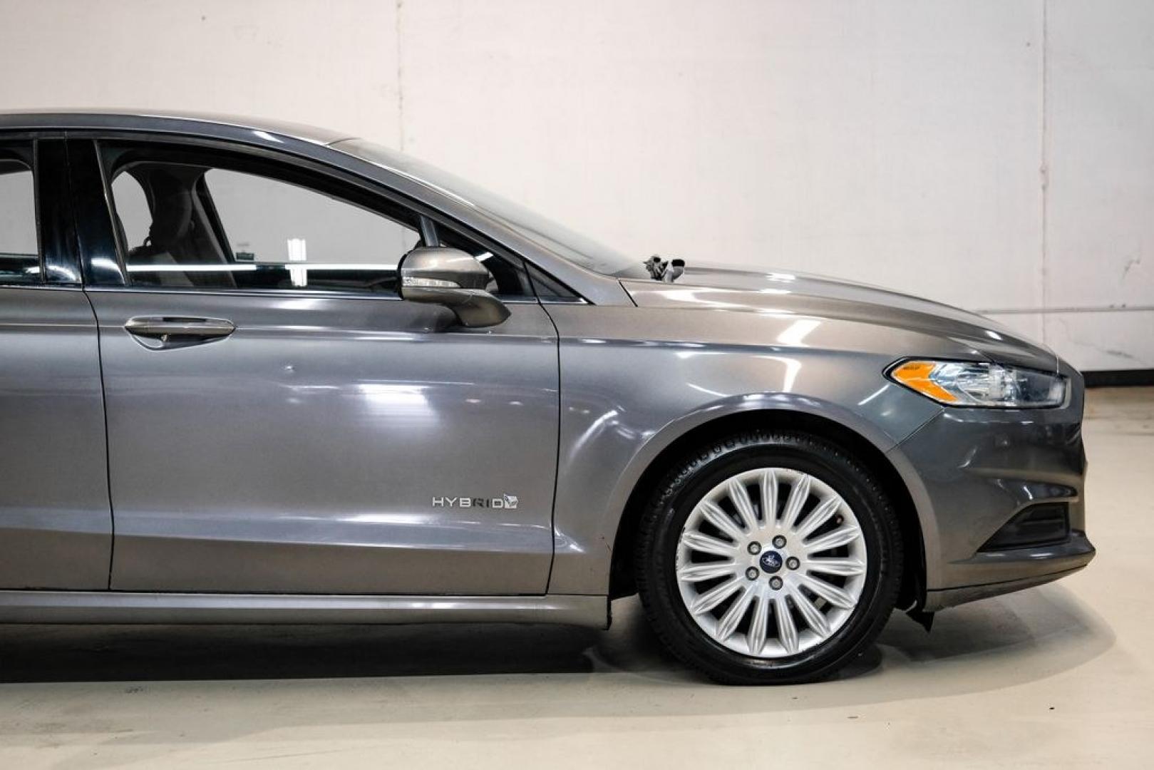 2014 Sterling Gray Metallic /Dune Ford Fusion Hybrid SE (3FA6P0LU0ER) with an 2.0L I4 Atkinson-Cycle Hybrid engine, CVT transmission, located at 15300 Midway Rd., Addison, TX, 75001, (972) 702-0011, 32.958321, -96.838074- Photo#12