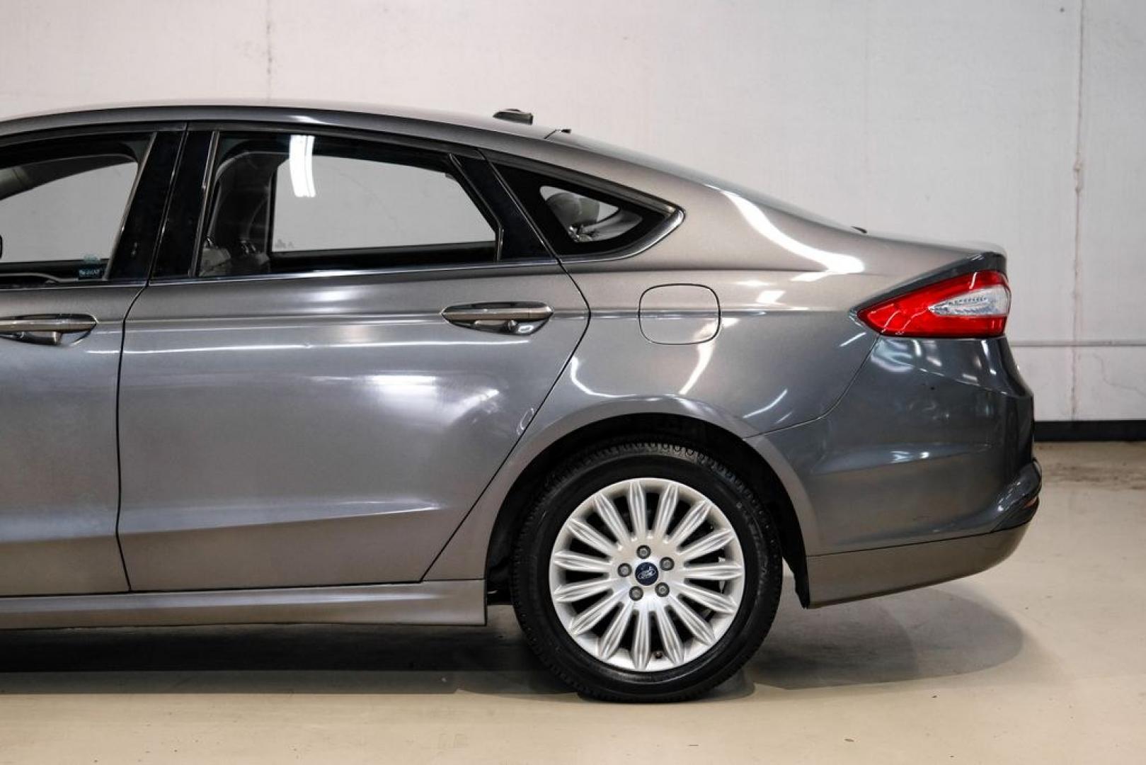 2014 Sterling Gray Metallic /Dune Ford Fusion Hybrid SE (3FA6P0LU0ER) with an 2.0L I4 Atkinson-Cycle Hybrid engine, CVT transmission, located at 15300 Midway Rd., Addison, TX, 75001, (972) 702-0011, 32.958321, -96.838074- Photo#14