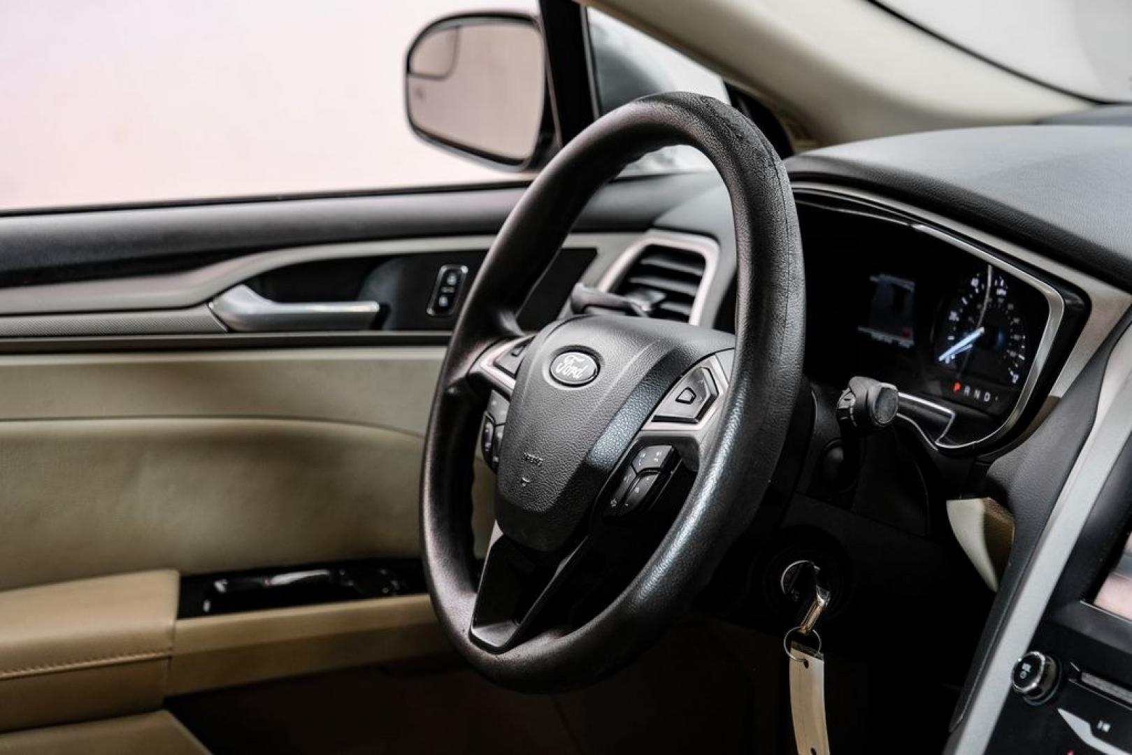 2014 Sterling Gray Metallic /Dune Ford Fusion Hybrid SE (3FA6P0LU0ER) with an 2.0L I4 Atkinson-Cycle Hybrid engine, CVT transmission, located at 15300 Midway Rd., Addison, TX, 75001, (972) 702-0011, 32.958321, -96.838074- Photo#16