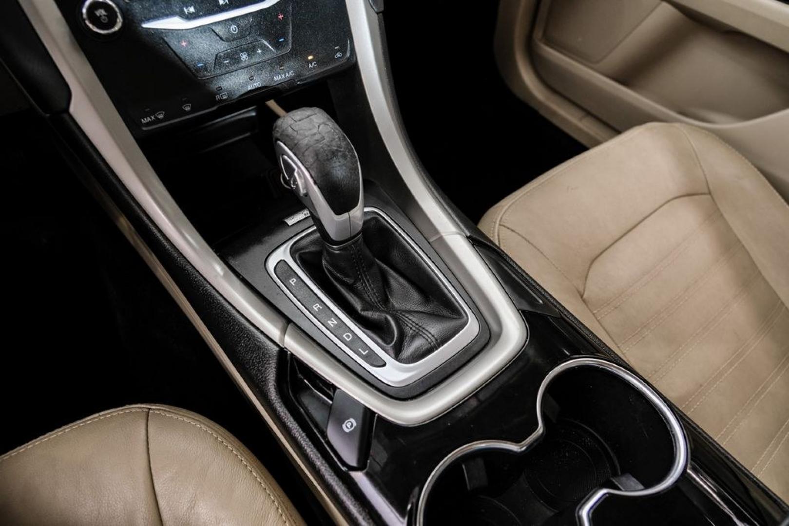 2014 Sterling Gray Metallic /Dune Ford Fusion Hybrid SE (3FA6P0LU0ER) with an 2.0L I4 Atkinson-Cycle Hybrid engine, CVT transmission, located at 15300 Midway Rd., Addison, TX, 75001, (972) 702-0011, 32.958321, -96.838074- Photo#25