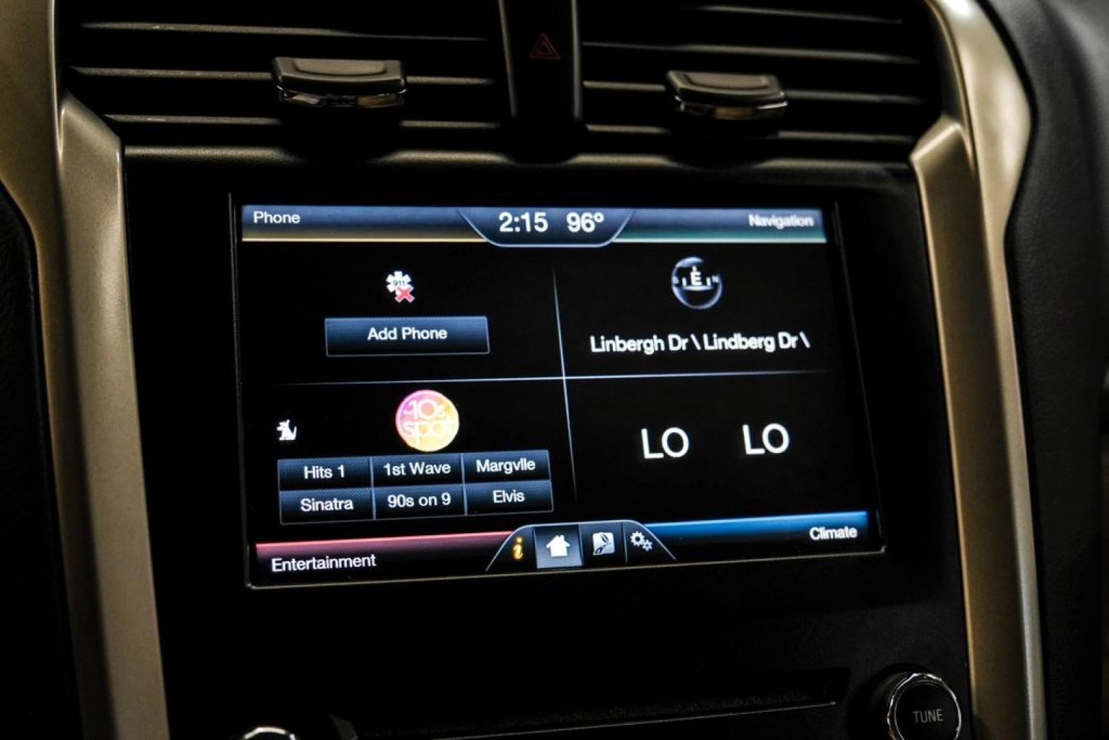 2014 Sterling Gray Metallic /Dune Ford Fusion Hybrid SE (3FA6P0LU0ER) with an 2.0L I4 Atkinson-Cycle Hybrid engine, CVT transmission, located at 15300 Midway Rd., Addison, TX, 75001, (972) 702-0011, 32.958321, -96.838074- Photo#35