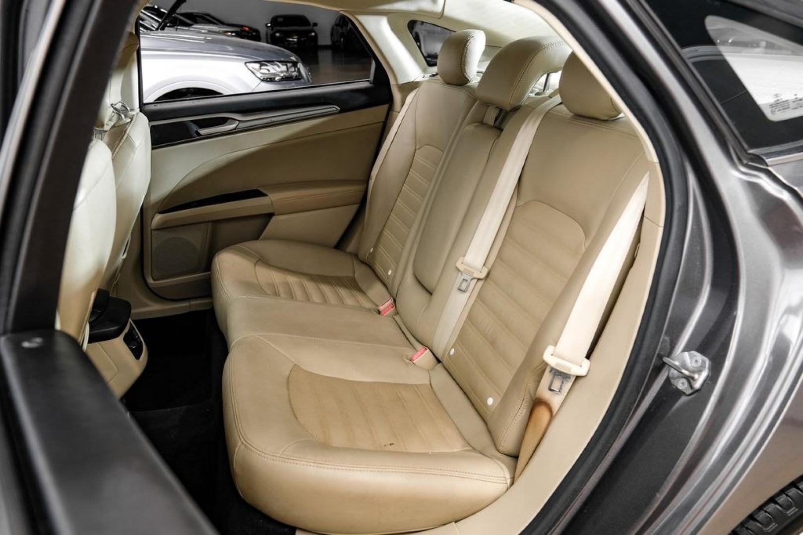 2014 Sterling Gray Metallic /Dune Ford Fusion Hybrid SE (3FA6P0LU0ER) with an 2.0L I4 Atkinson-Cycle Hybrid engine, CVT transmission, located at 15300 Midway Rd., Addison, TX, 75001, (972) 702-0011, 32.958321, -96.838074- Photo#46