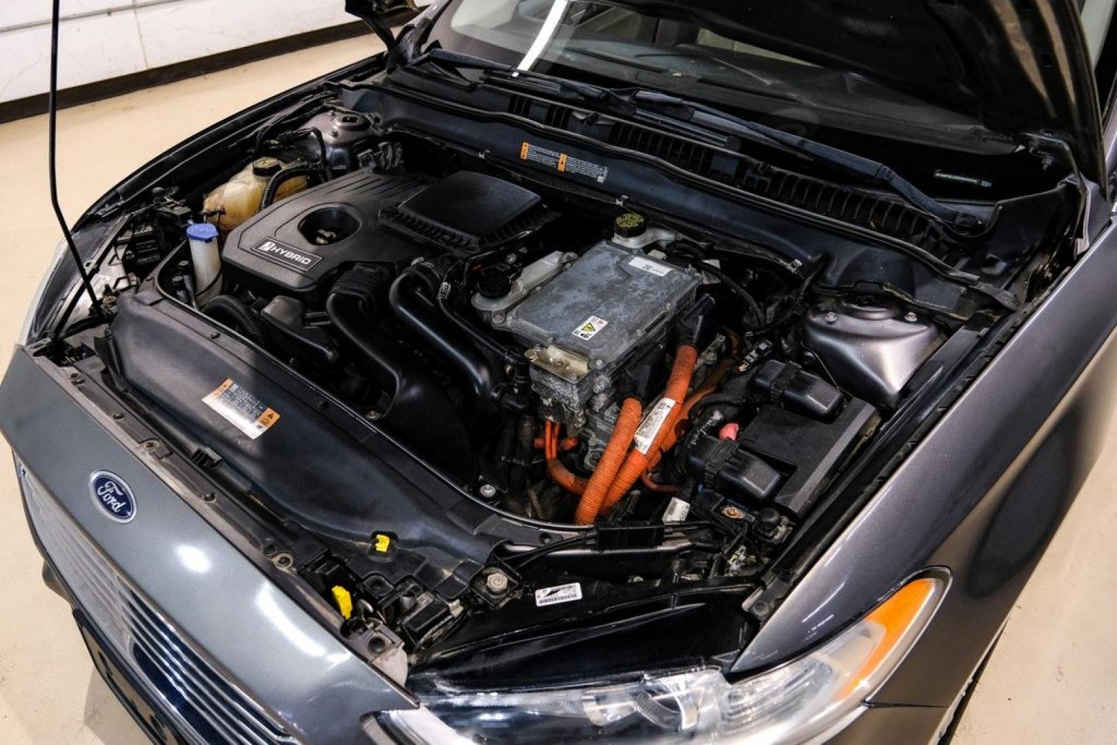 2014 Sterling Gray Metallic /Dune Ford Fusion Hybrid SE (3FA6P0LU0ER) with an 2.0L I4 Atkinson-Cycle Hybrid engine, CVT transmission, located at 15300 Midway Rd., Addison, TX, 75001, (972) 702-0011, 32.958321, -96.838074- Photo#57