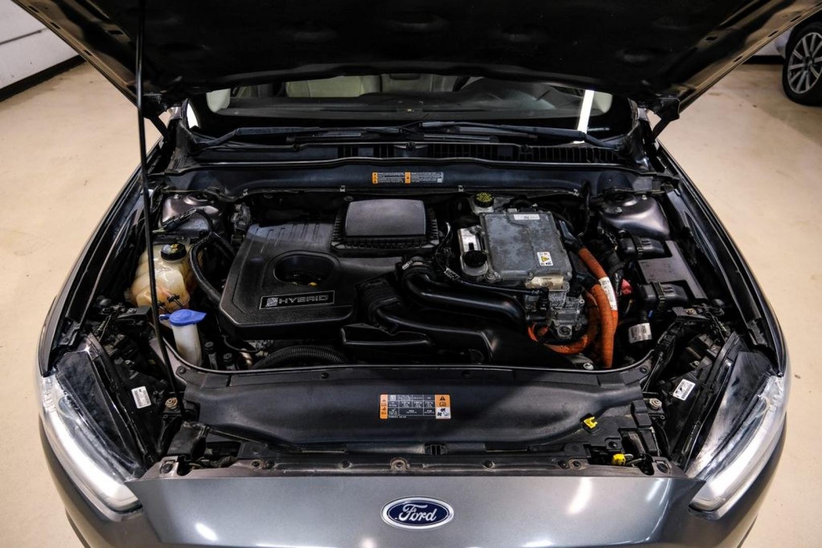 2014 Sterling Gray Metallic /Dune Ford Fusion Hybrid SE (3FA6P0LU0ER) with an 2.0L I4 Atkinson-Cycle Hybrid engine, CVT transmission, located at 15300 Midway Rd., Addison, TX, 75001, (972) 702-0011, 32.958321, -96.838074- Photo#58