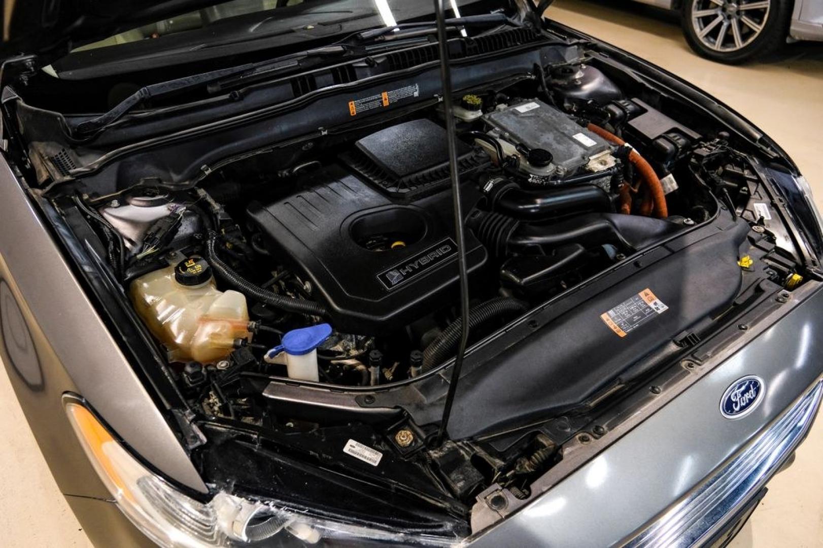 2014 Sterling Gray Metallic /Dune Ford Fusion Hybrid SE (3FA6P0LU0ER) with an 2.0L I4 Atkinson-Cycle Hybrid engine, CVT transmission, located at 15300 Midway Rd., Addison, TX, 75001, (972) 702-0011, 32.958321, -96.838074- Photo#59