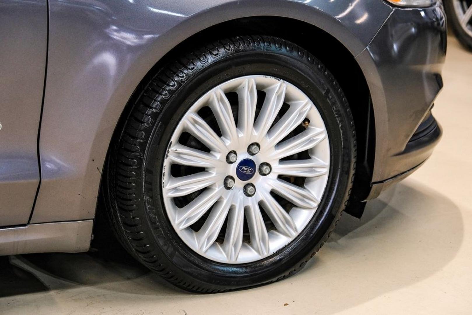 2014 Sterling Gray Metallic /Dune Ford Fusion Hybrid SE (3FA6P0LU0ER) with an 2.0L I4 Atkinson-Cycle Hybrid engine, CVT transmission, located at 15300 Midway Rd., Addison, TX, 75001, (972) 702-0011, 32.958321, -96.838074- Photo#64