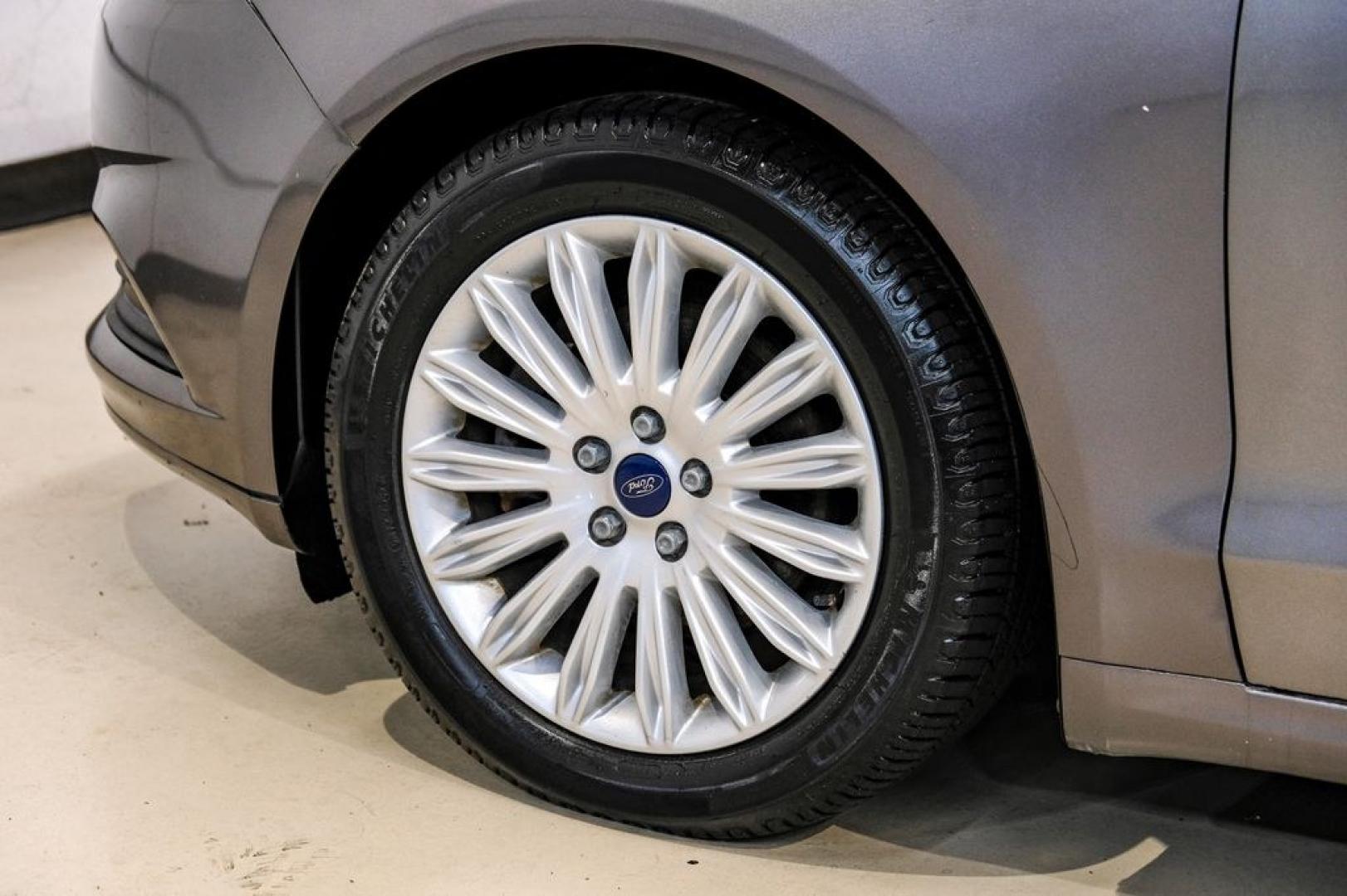 2014 Sterling Gray Metallic /Dune Ford Fusion Hybrid SE (3FA6P0LU0ER) with an 2.0L I4 Atkinson-Cycle Hybrid engine, CVT transmission, located at 15300 Midway Rd., Addison, TX, 75001, (972) 702-0011, 32.958321, -96.838074- Photo#65