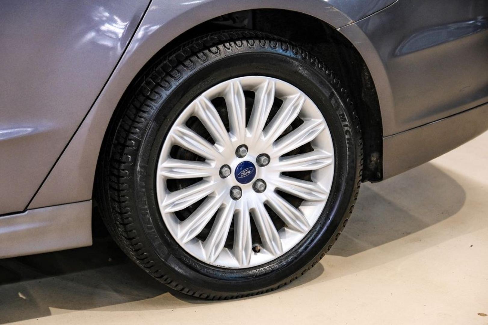 2014 Sterling Gray Metallic /Dune Ford Fusion Hybrid SE (3FA6P0LU0ER) with an 2.0L I4 Atkinson-Cycle Hybrid engine, CVT transmission, located at 15300 Midway Rd., Addison, TX, 75001, (972) 702-0011, 32.958321, -96.838074- Photo#66