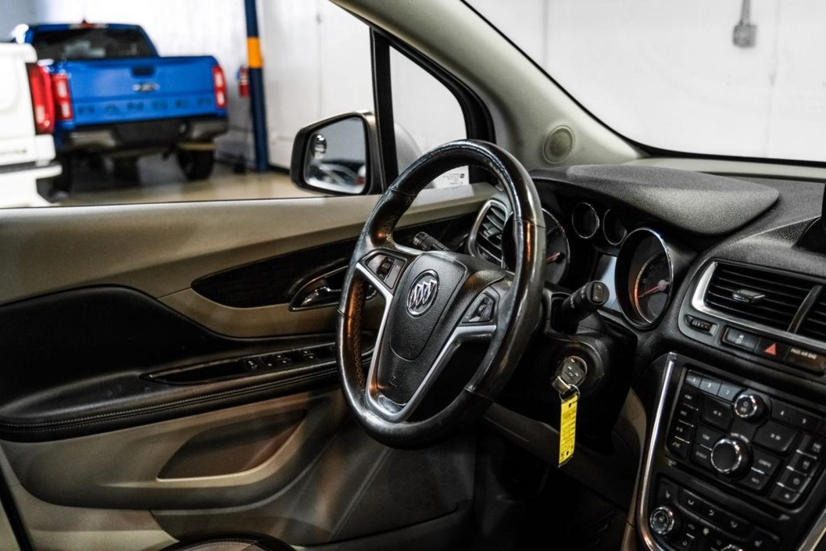 2013 Steel Gray Metallic /Titanium Buick Encore Premium (KL4CJDSB4DB) with an ECOTEC 1.4L I4 SMPI DOHC Turbocharged VVT engine, Automatic transmission, located at 15300 Midway Rd., Addison, TX, 75001, (972) 702-0011, 32.958321, -96.838074- Photo#14