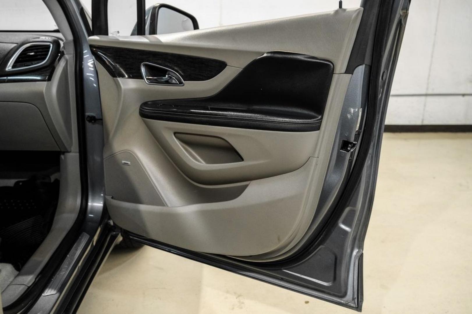 2013 Steel Gray Metallic /Titanium Buick Encore Premium (KL4CJDSB4DB) with an ECOTEC 1.4L I4 SMPI DOHC Turbocharged VVT engine, Automatic transmission, located at 15300 Midway Rd., Addison, TX, 75001, (972) 702-0011, 32.958321, -96.838074- Photo#37