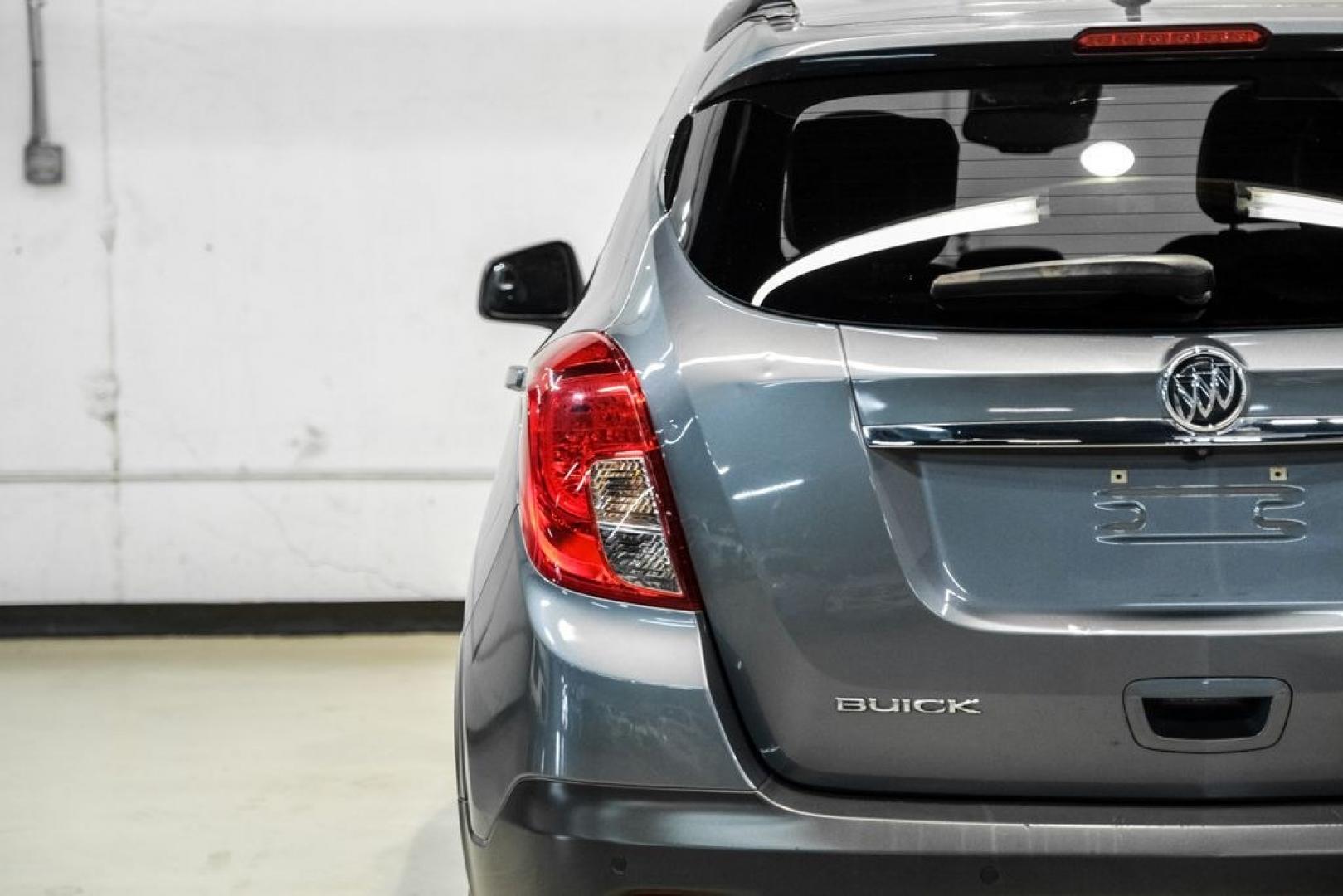 2013 Steel Gray Metallic /Titanium Buick Encore Premium (KL4CJDSB4DB) with an ECOTEC 1.4L I4 SMPI DOHC Turbocharged VVT engine, Automatic transmission, located at 15300 Midway Rd., Addison, TX, 75001, (972) 702-0011, 32.958321, -96.838074- Photo#41